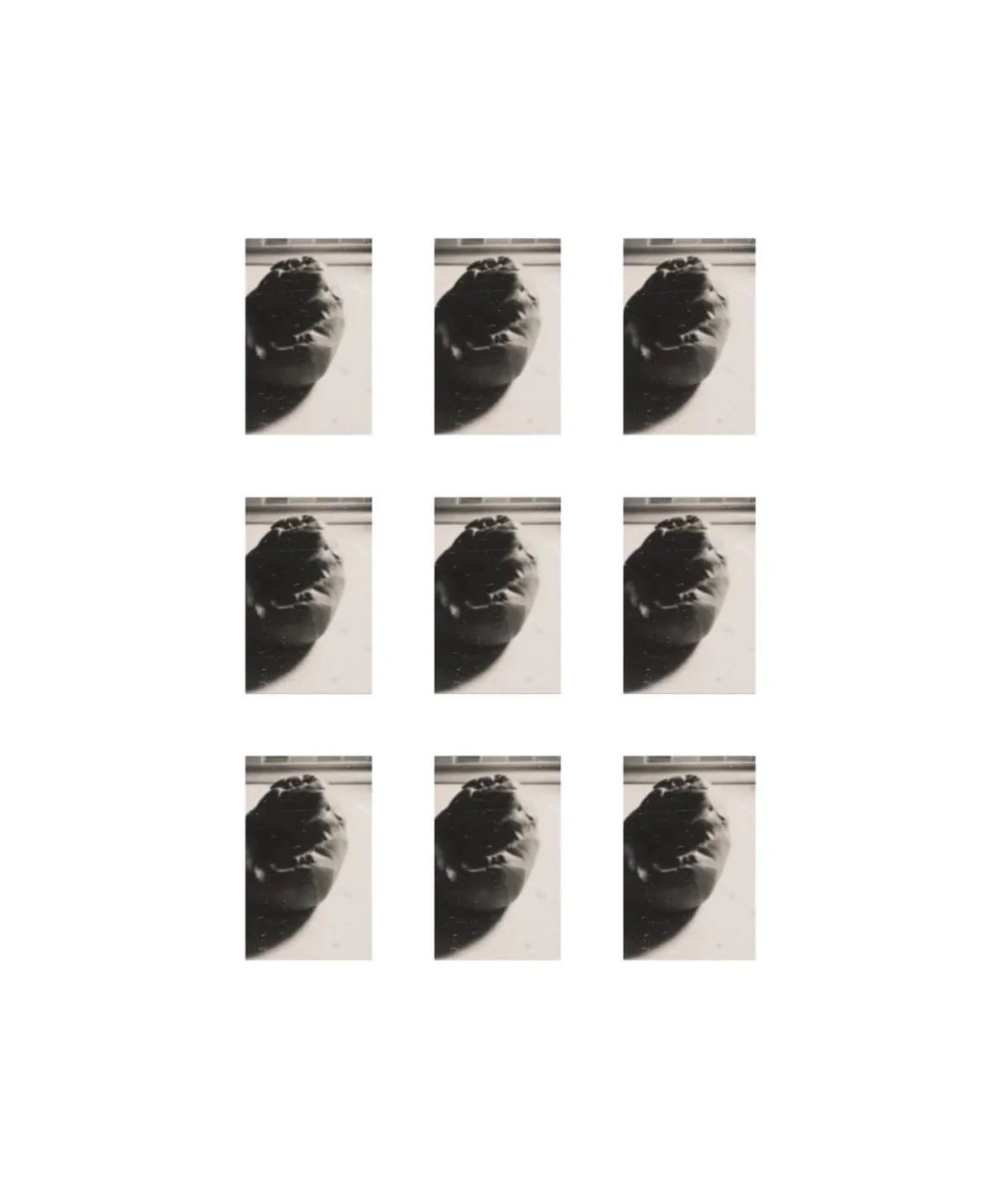 A pattern of nine black and white photos arranged in a 3x3 grid, each depicting the same close-up shot of a clay kneaded on the workbench casts a long shadow on the bench.