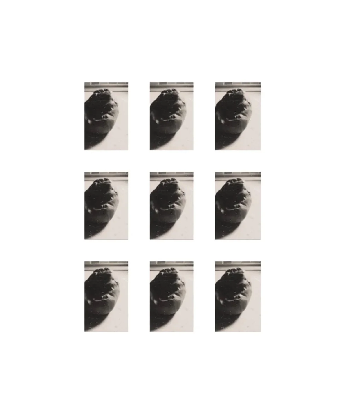 Six rows of three black and white photograph of a clay kneaded on the workbench casts a long shadow on the bench.