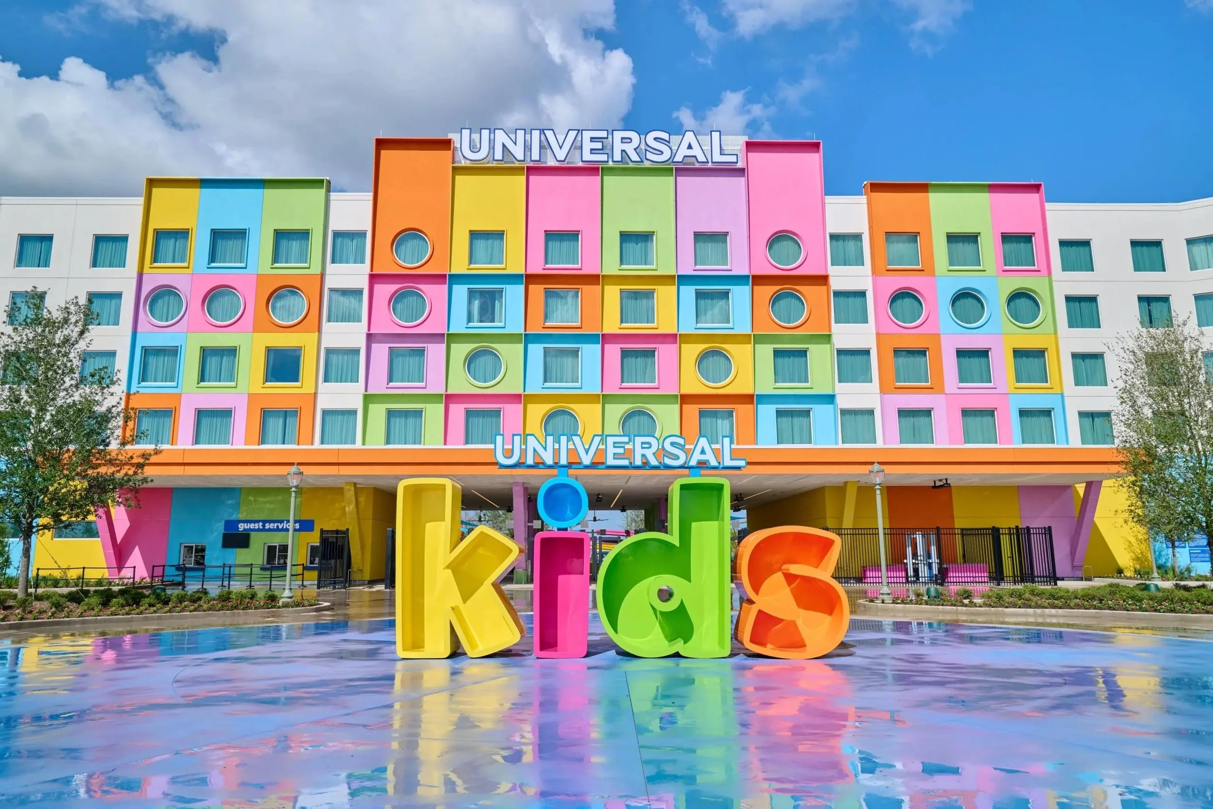 Colorful building with the word "UNIVERSAL" on top and large, colorful, block-style letters spelling "KIDS" in front