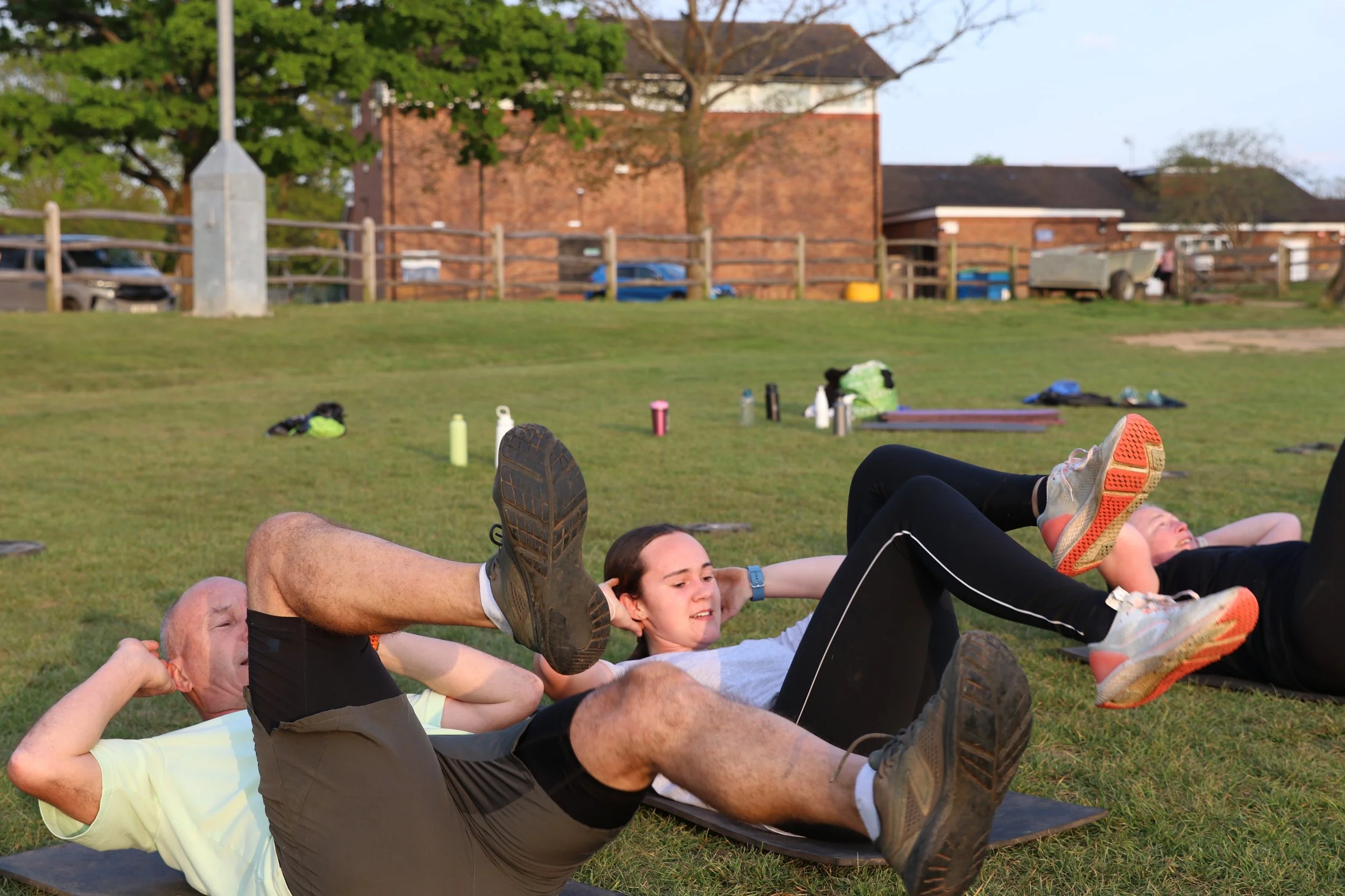 Man and women exercising together.