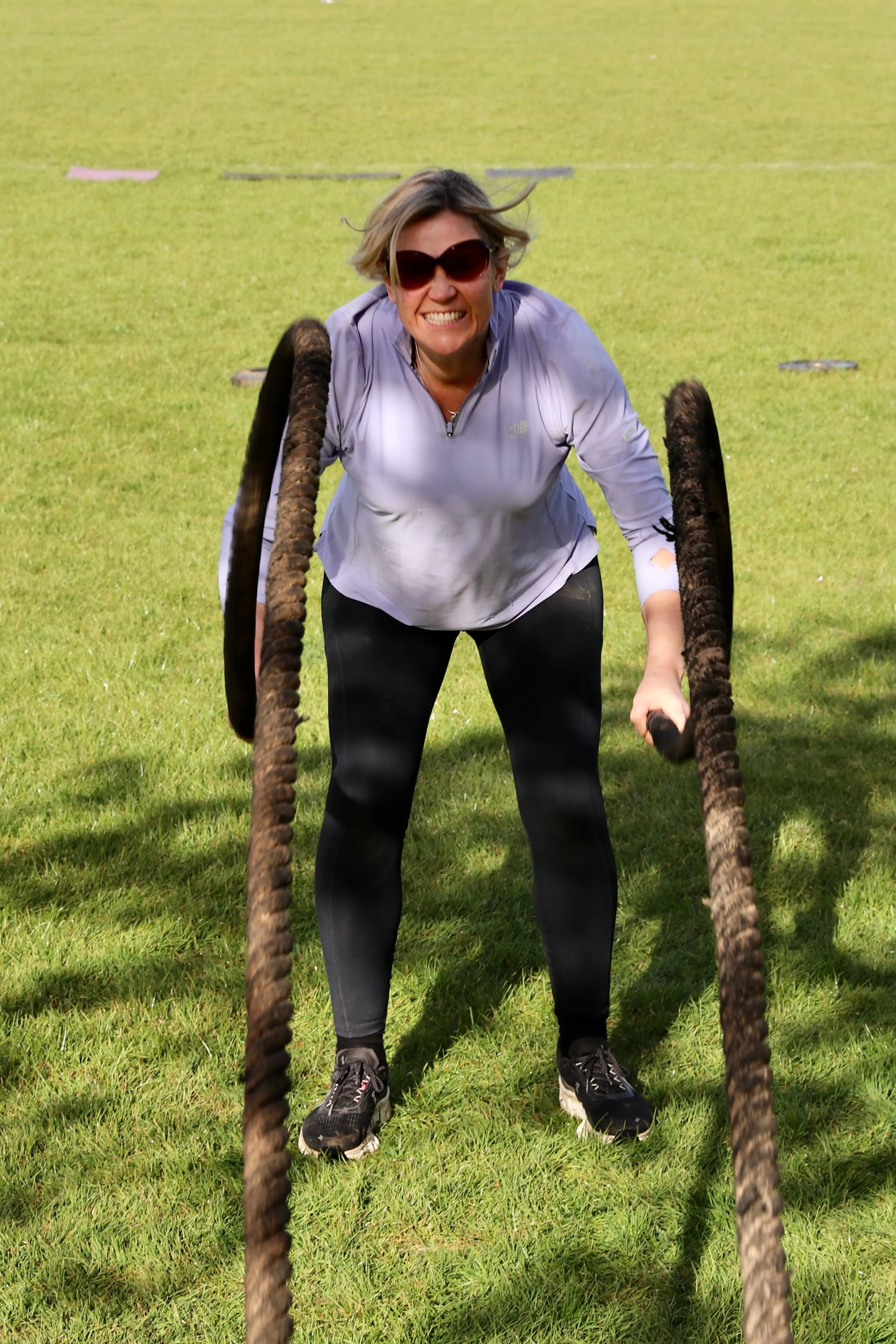 Female using exercise equipment.
