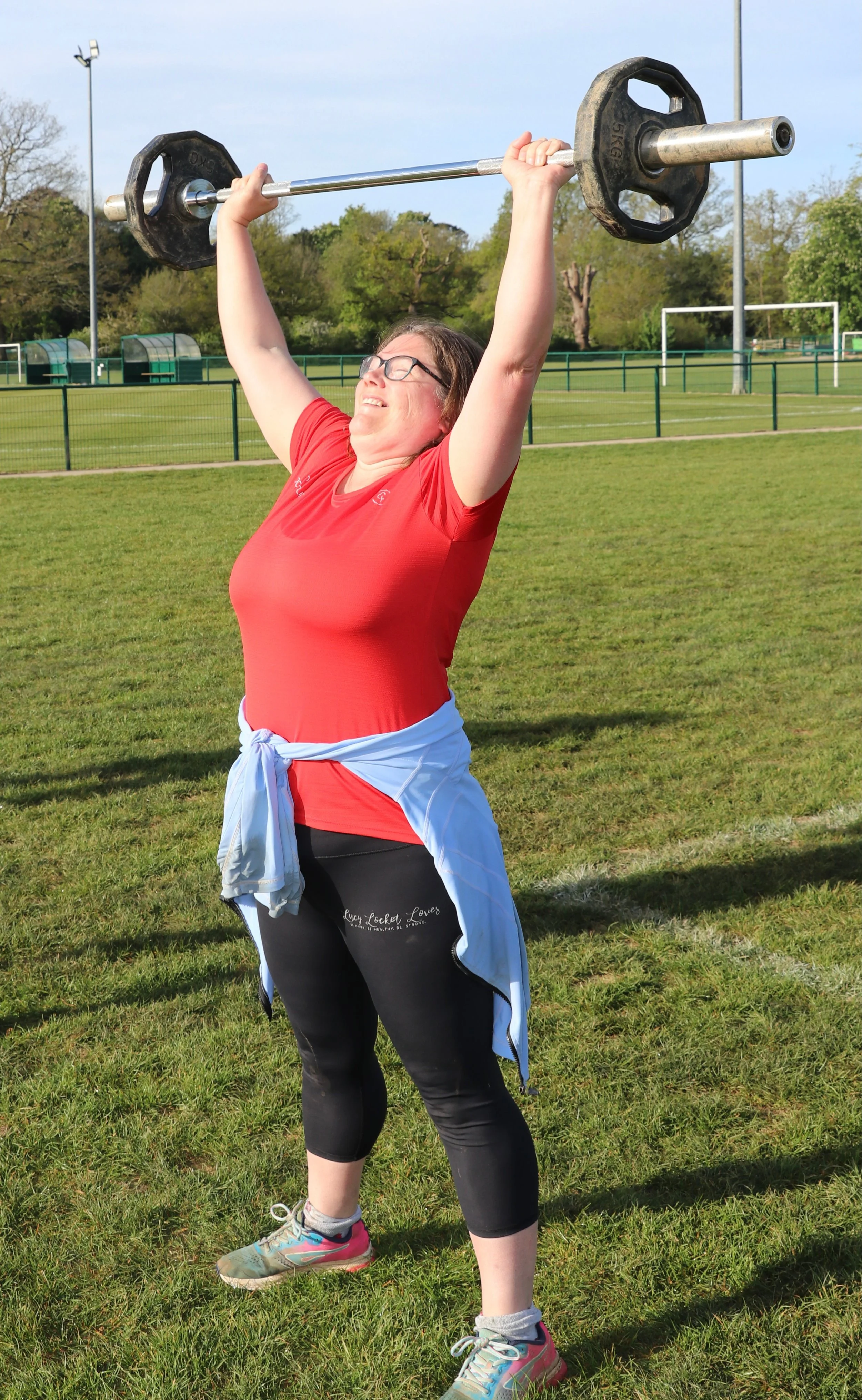 Lady lifting weights.