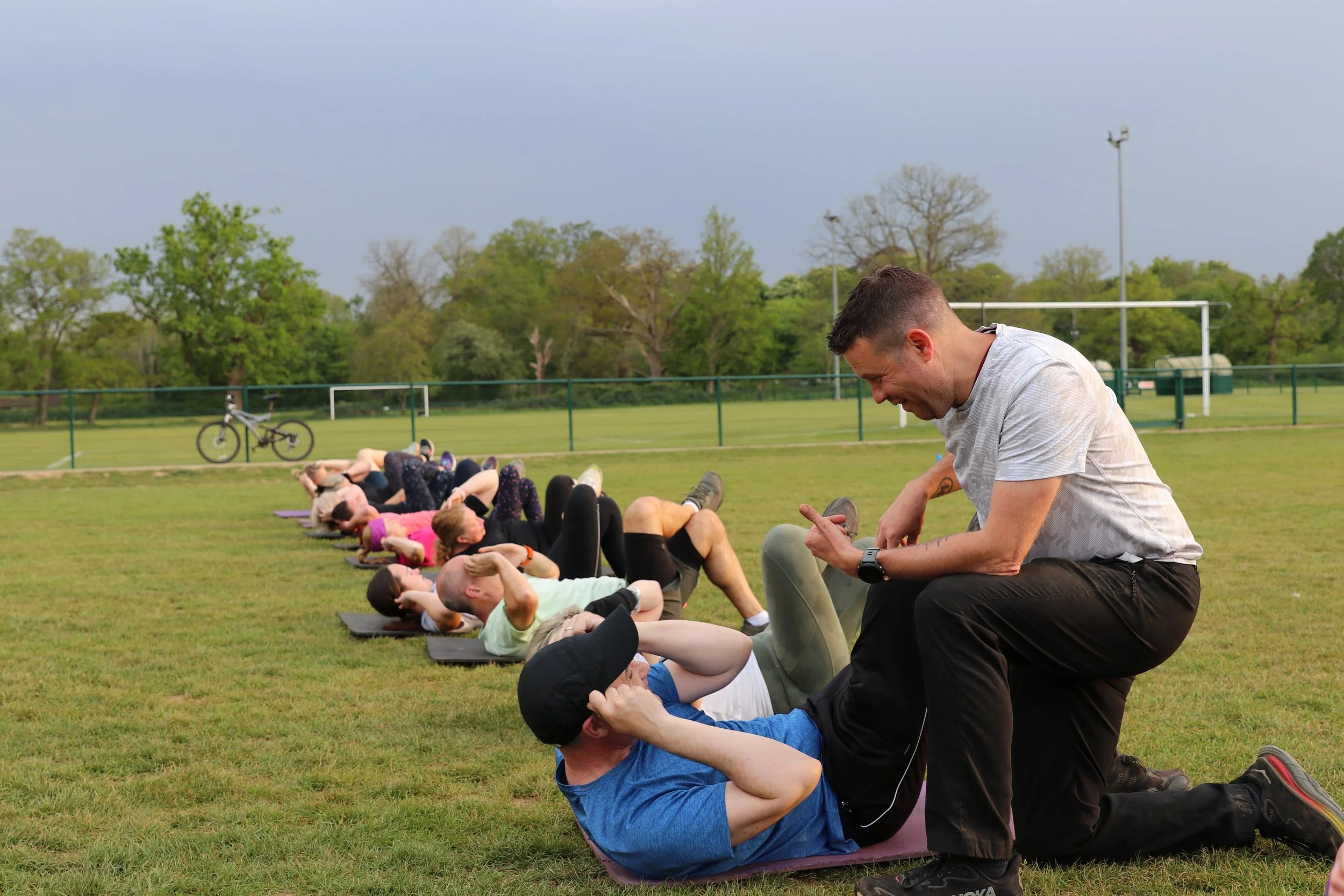 Personal trainer working with a client.