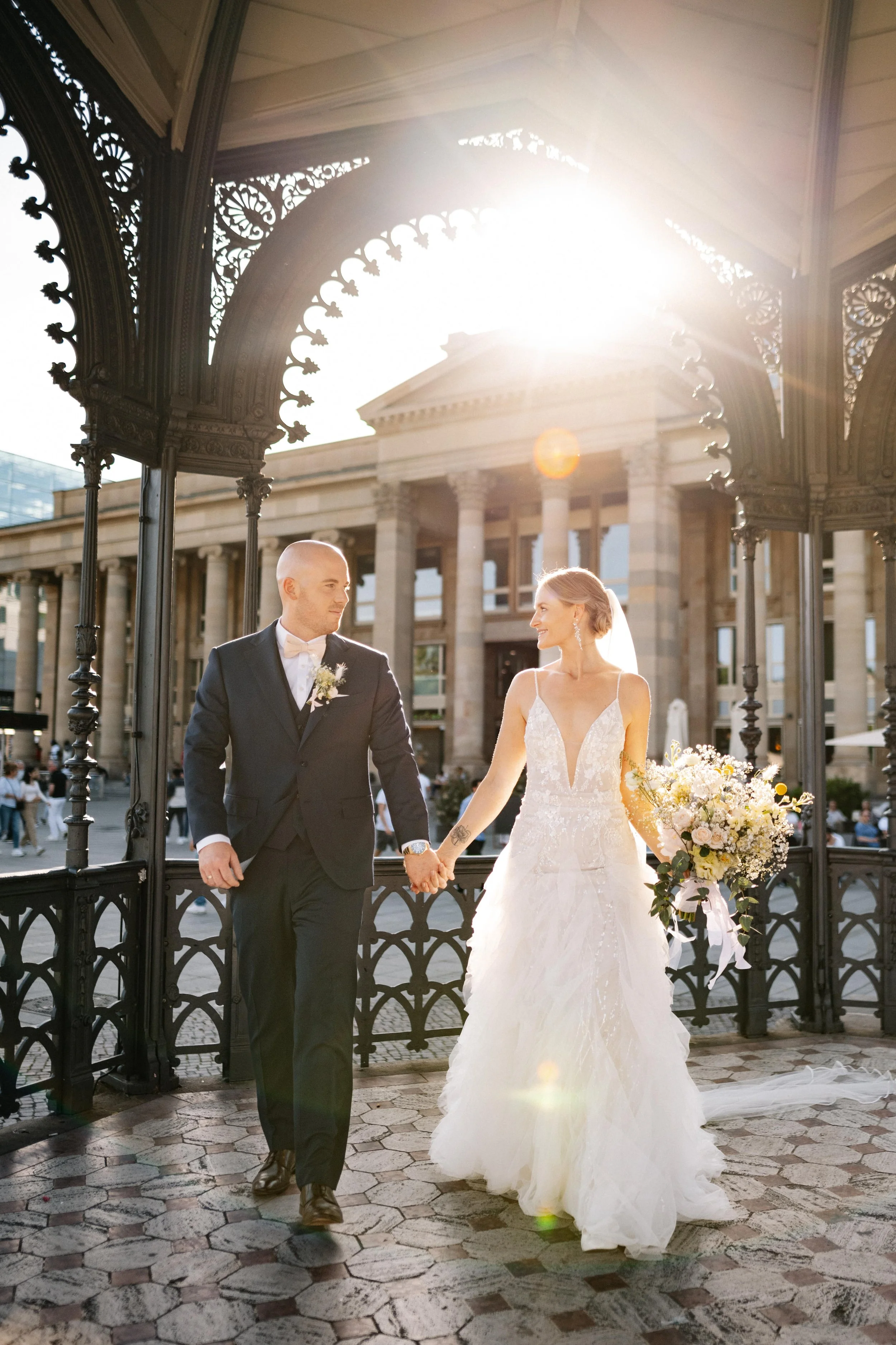 Laurie’s customers, Larissa and Emmett, just married walking off the aisle together.
