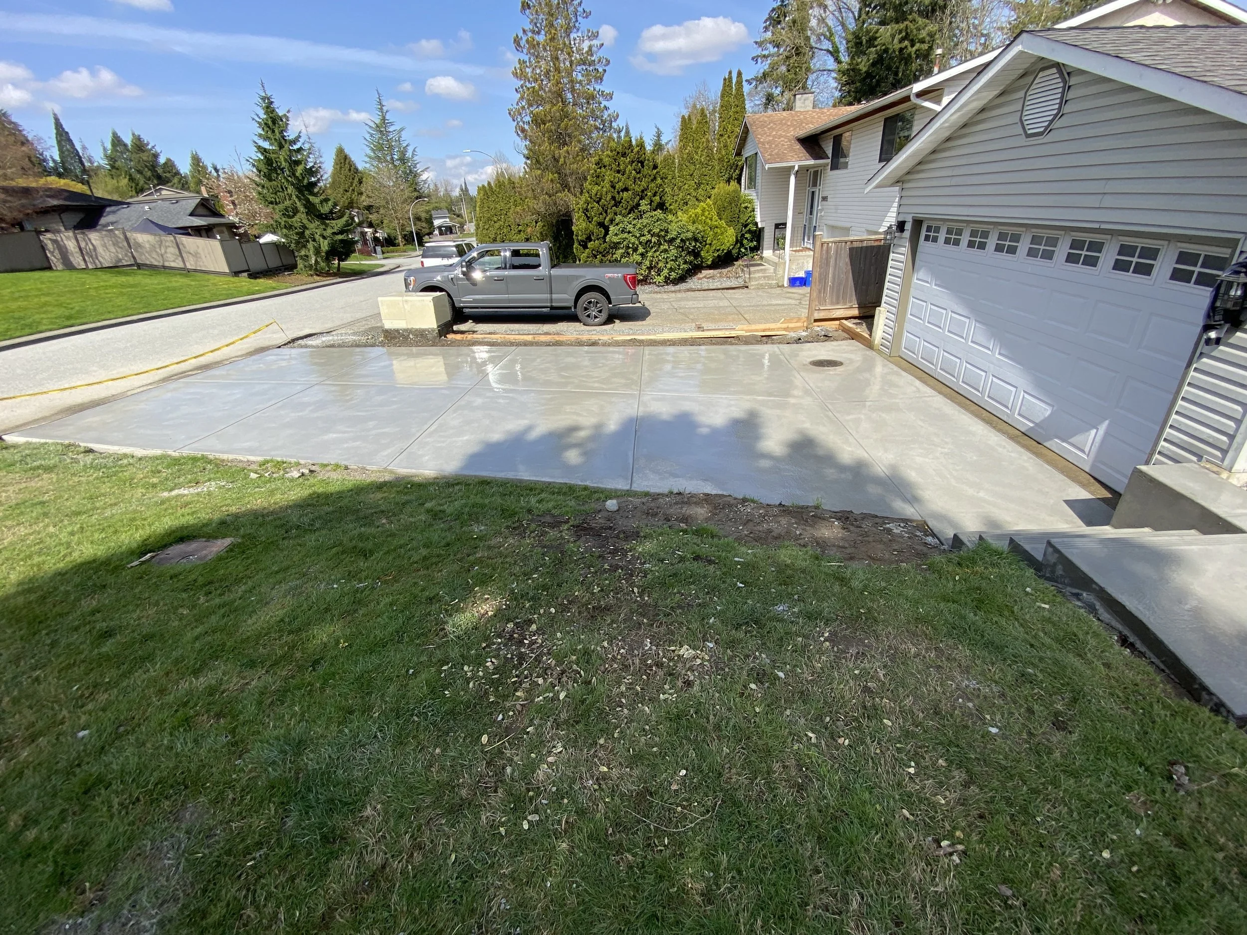 Front Yard Makeover with Custom Concrete Driveway, Stairs, and Drainage