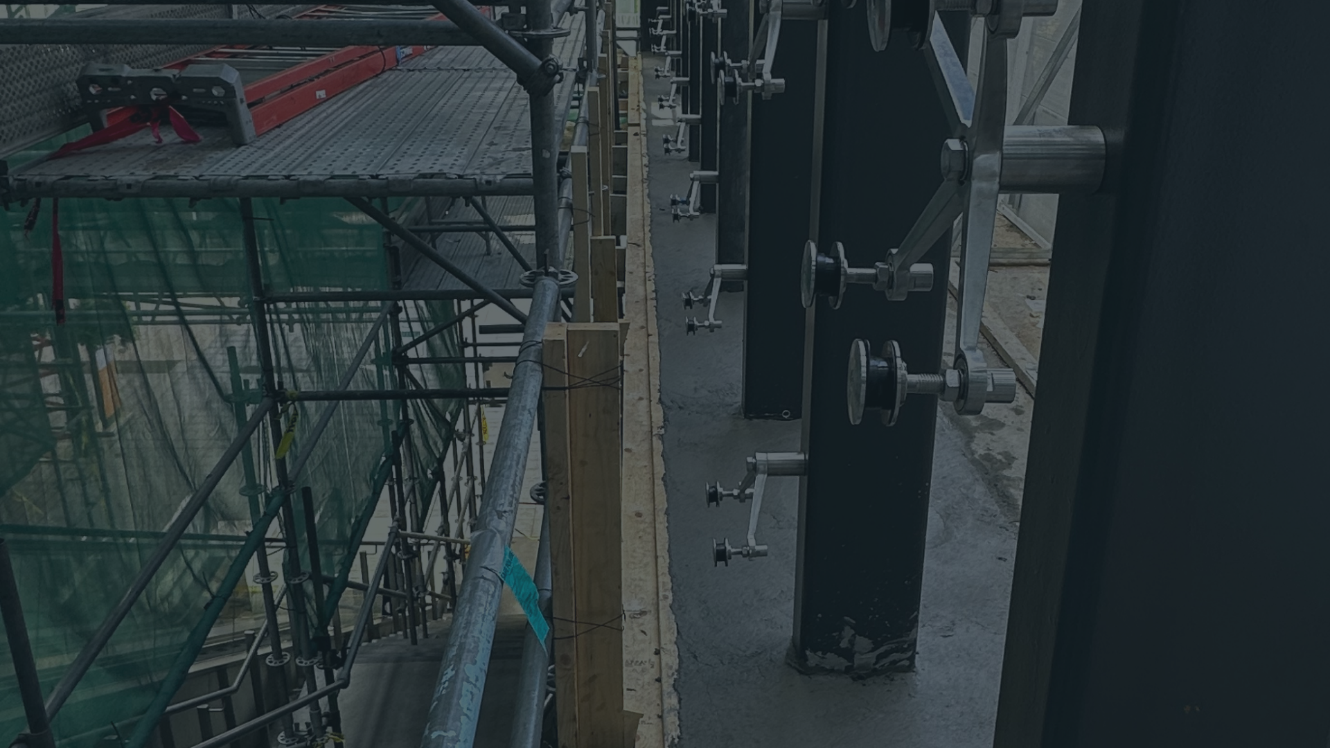 Construction site with scaffolding and safety equipment on a building during construction.