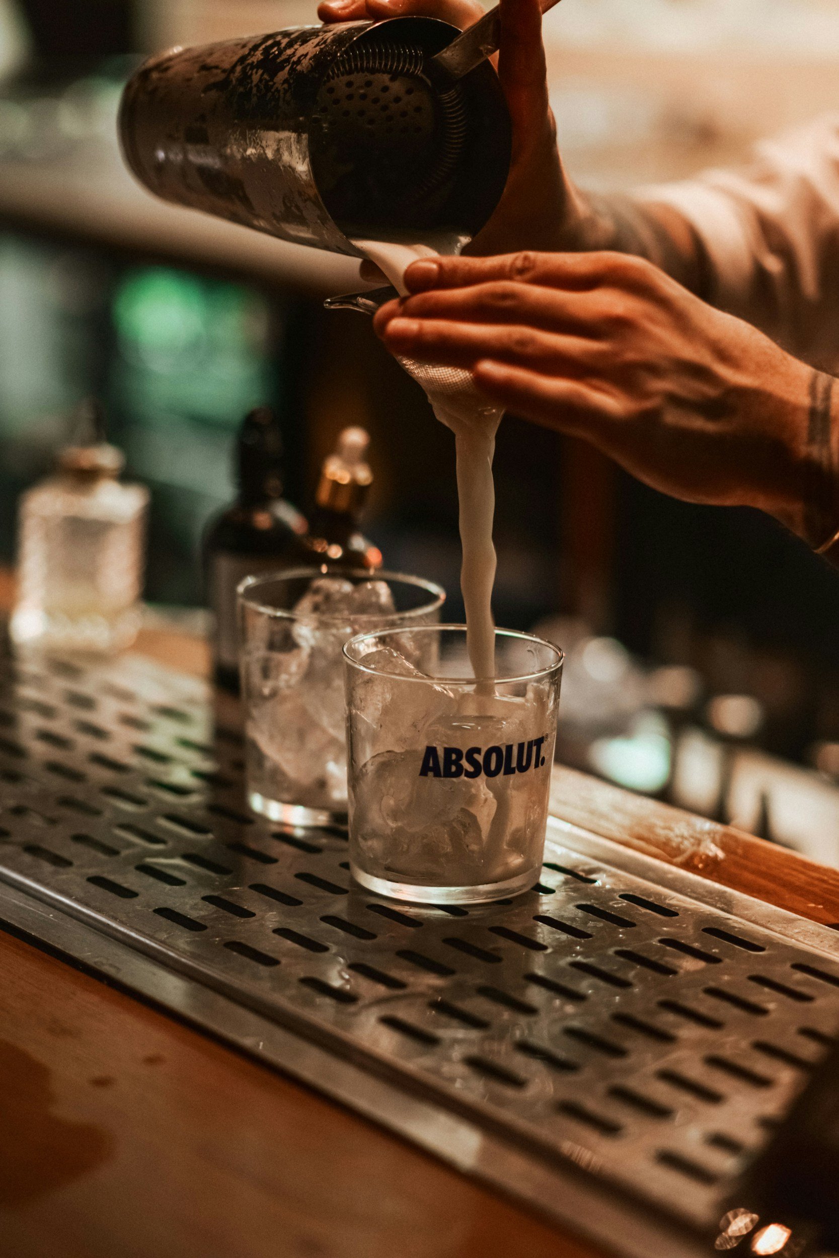 Bartender serving guests at an Alabama restaurant bar