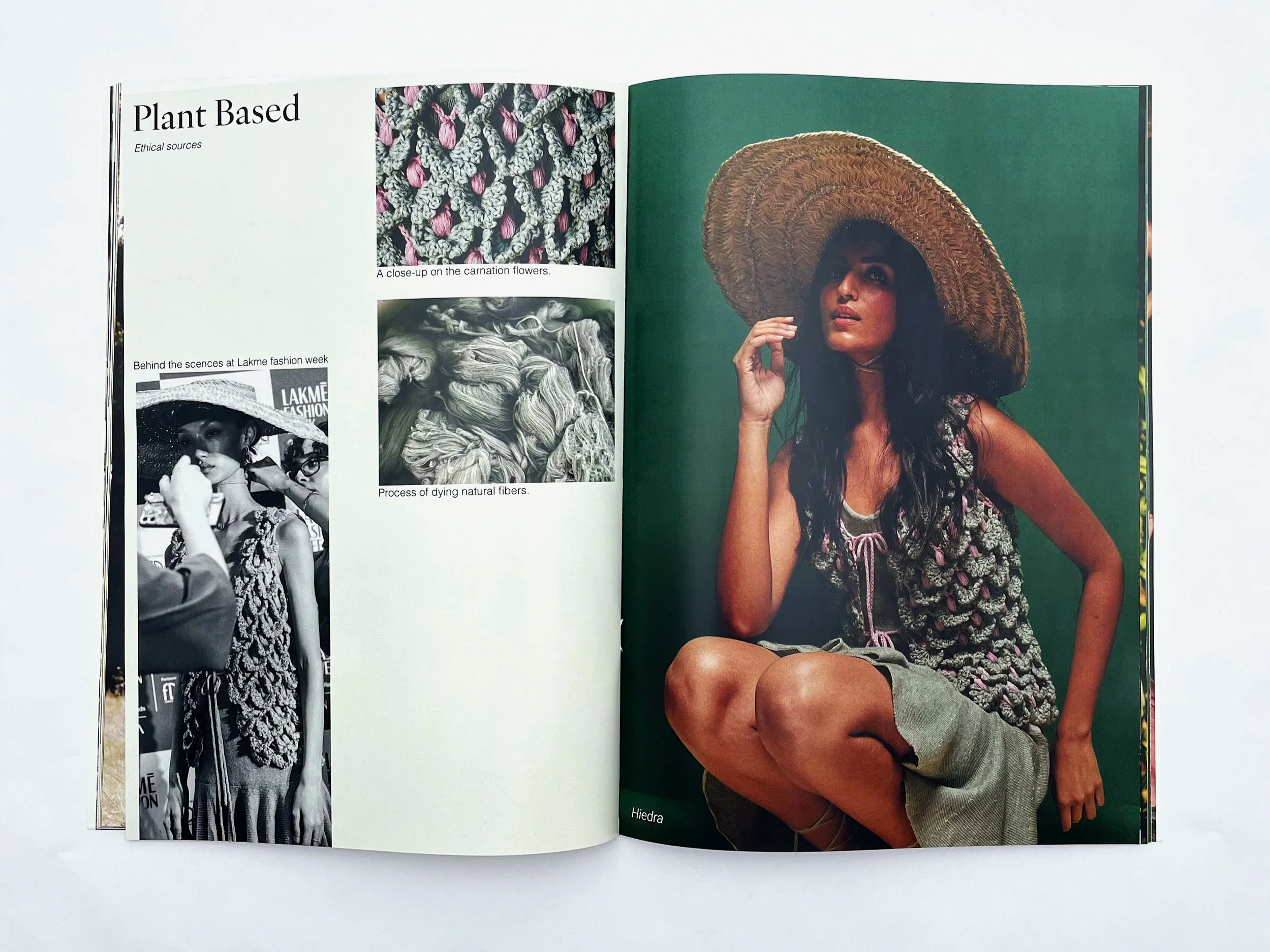 Open magazine showing fashion photos, including a close-up of carnation flowers, a behind-the-scenes shot at Lakme Fashion Week in black and white, and a full-color portrait of a woman wearing a large straw hat and casual clothing, sitting with one knee up against a green background.