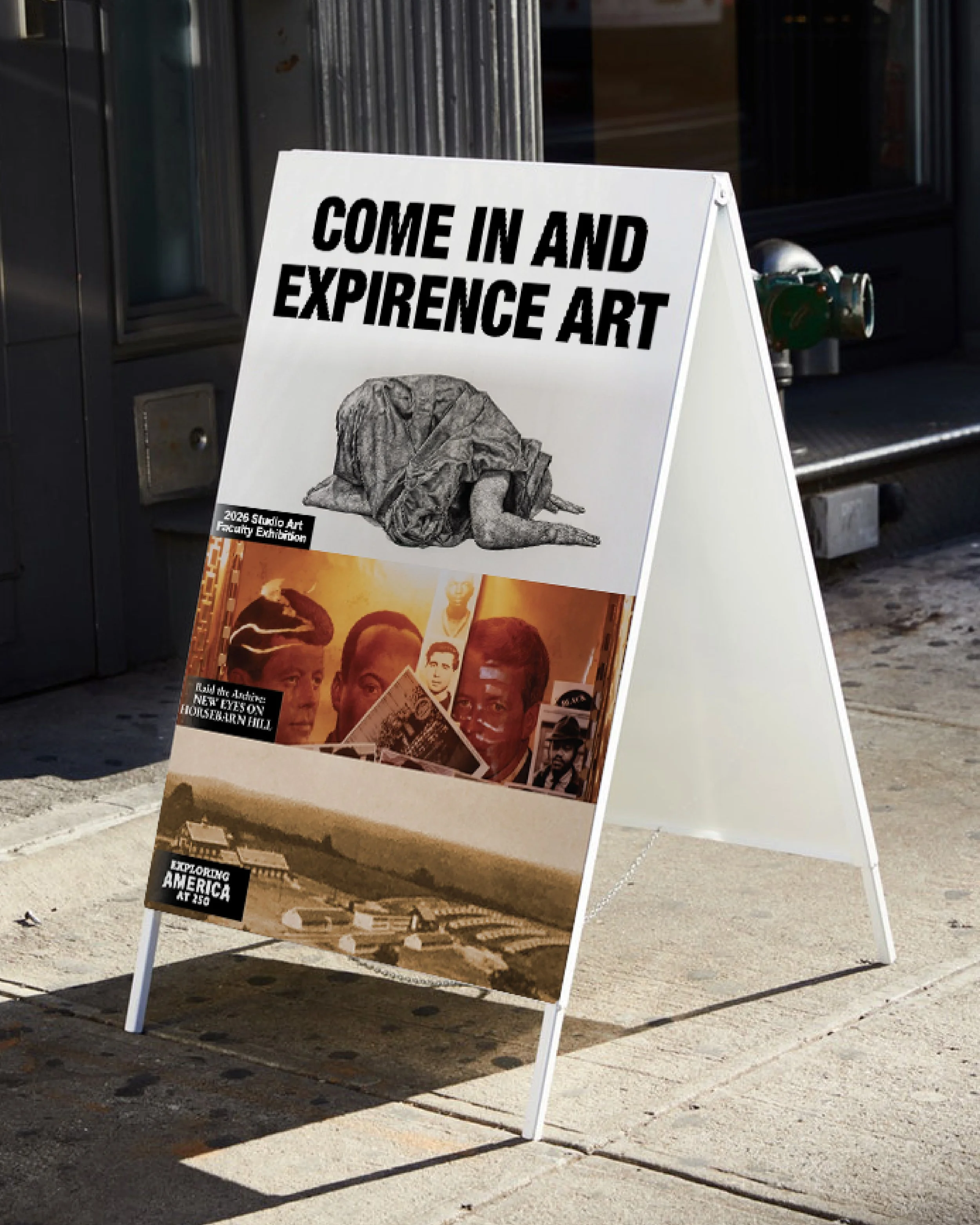 A white sandwich board sign on sidewalk with black bold text reading 'Come in and Expire Art,' next to a sculpture of a dog lying down with folded front paws, in front of a building entrance.