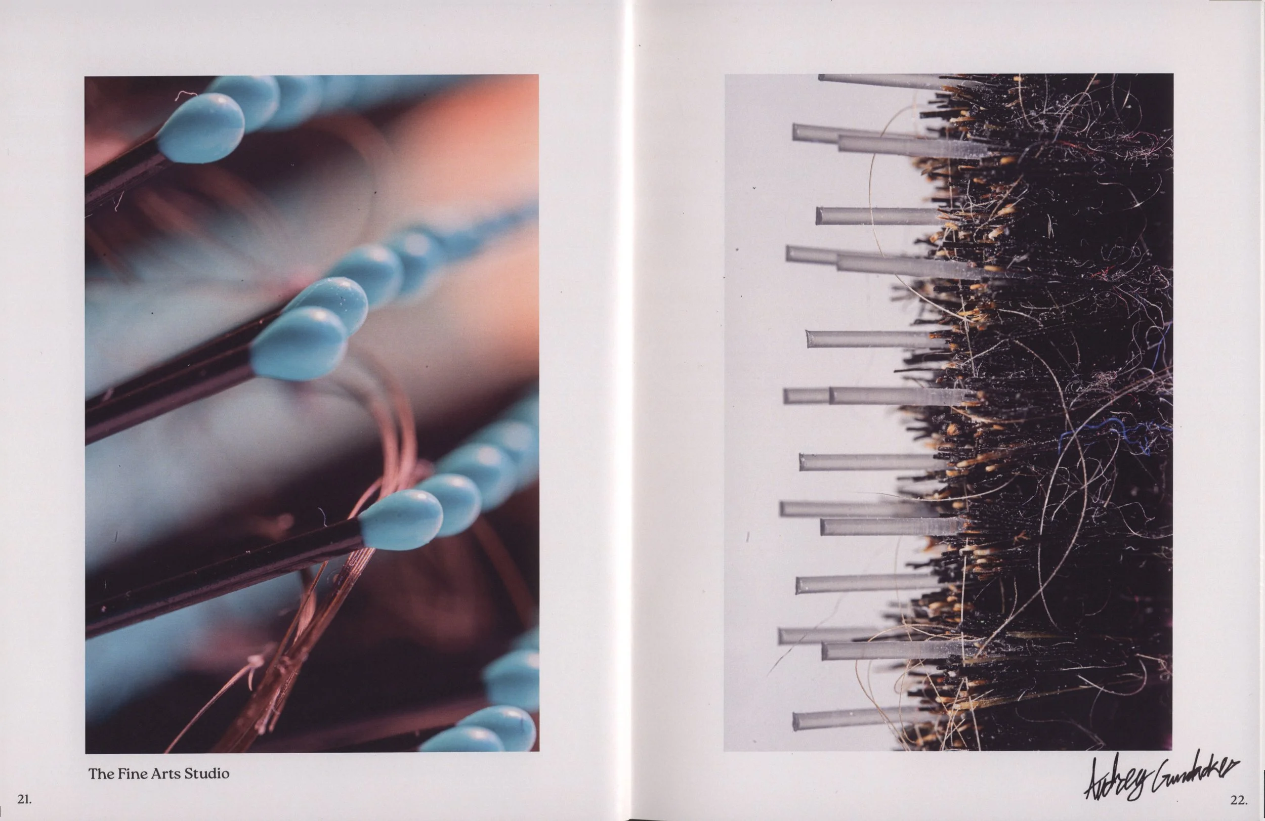 Two pages from an art book showing abstract artwork. The left page features a close-up of paintbrushes with light blue tips, and the right page shows pencils or paintbrushes stuck into a dark, tangled, fiber-like material.