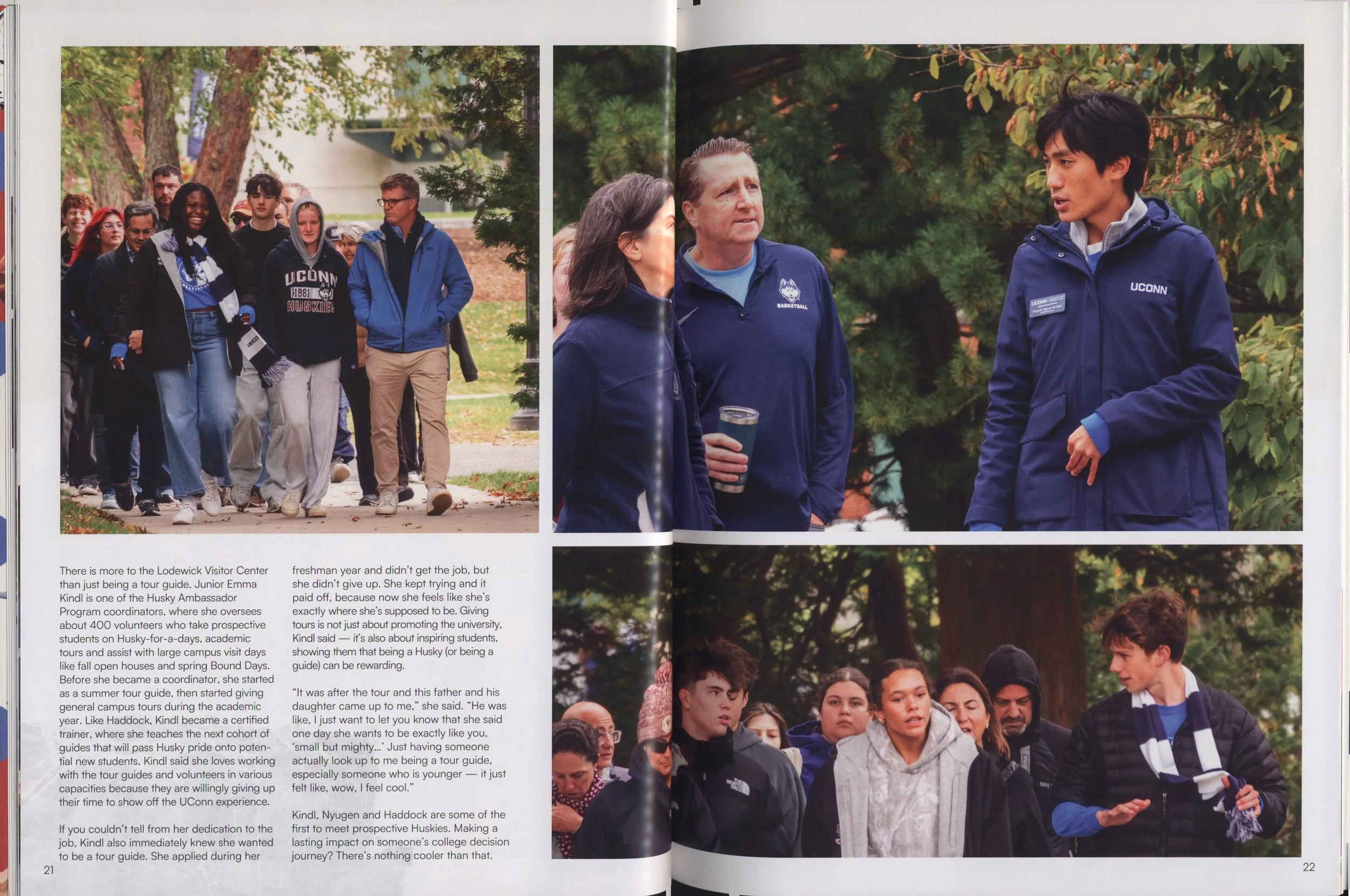 Group photo of students and staff at an outdoor university event, with trees in the background. The students are wearing UConn-branded clothing.