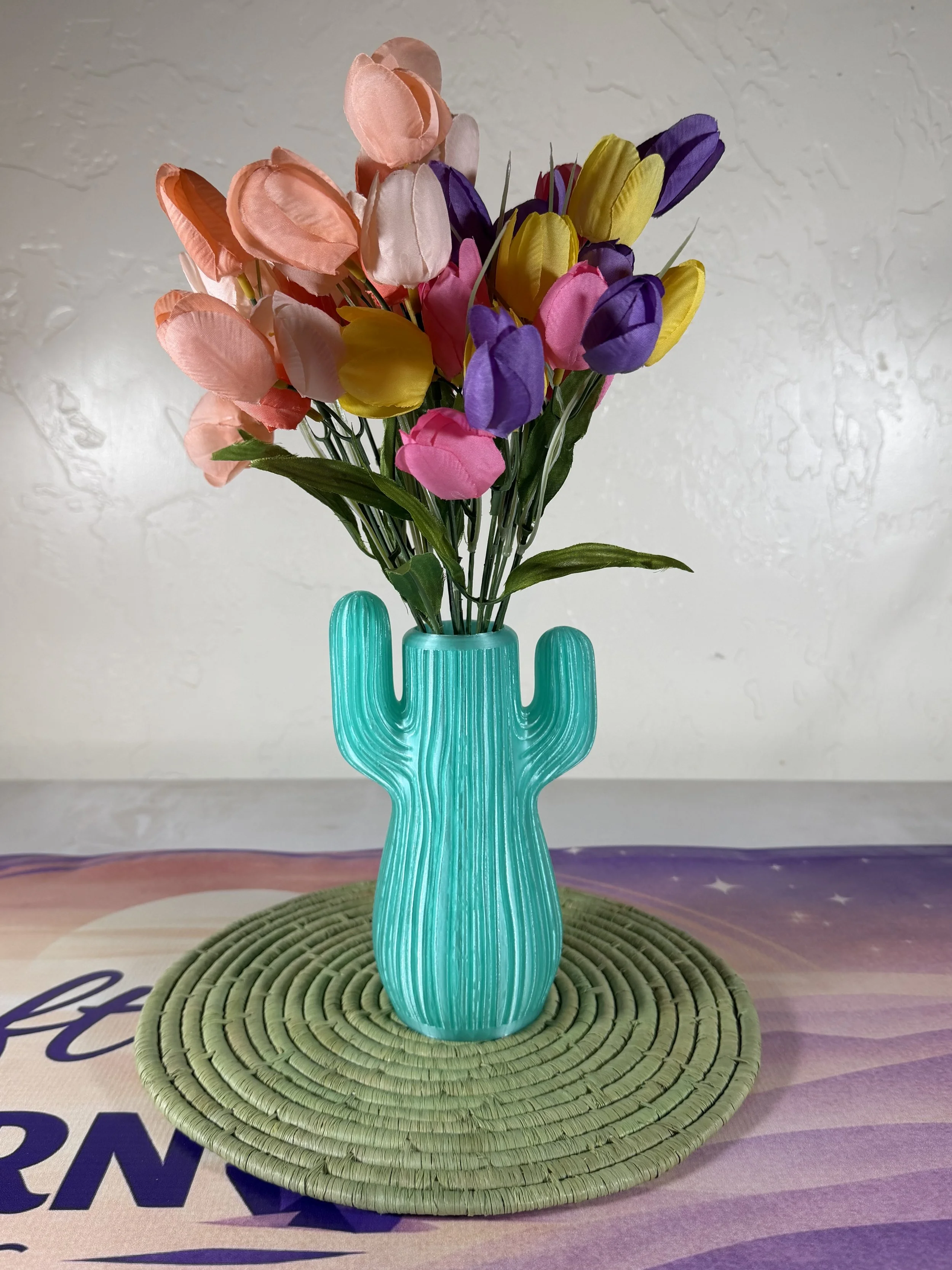 saguaro-cactus-vase-translucent-teal-with-flowers.jpg