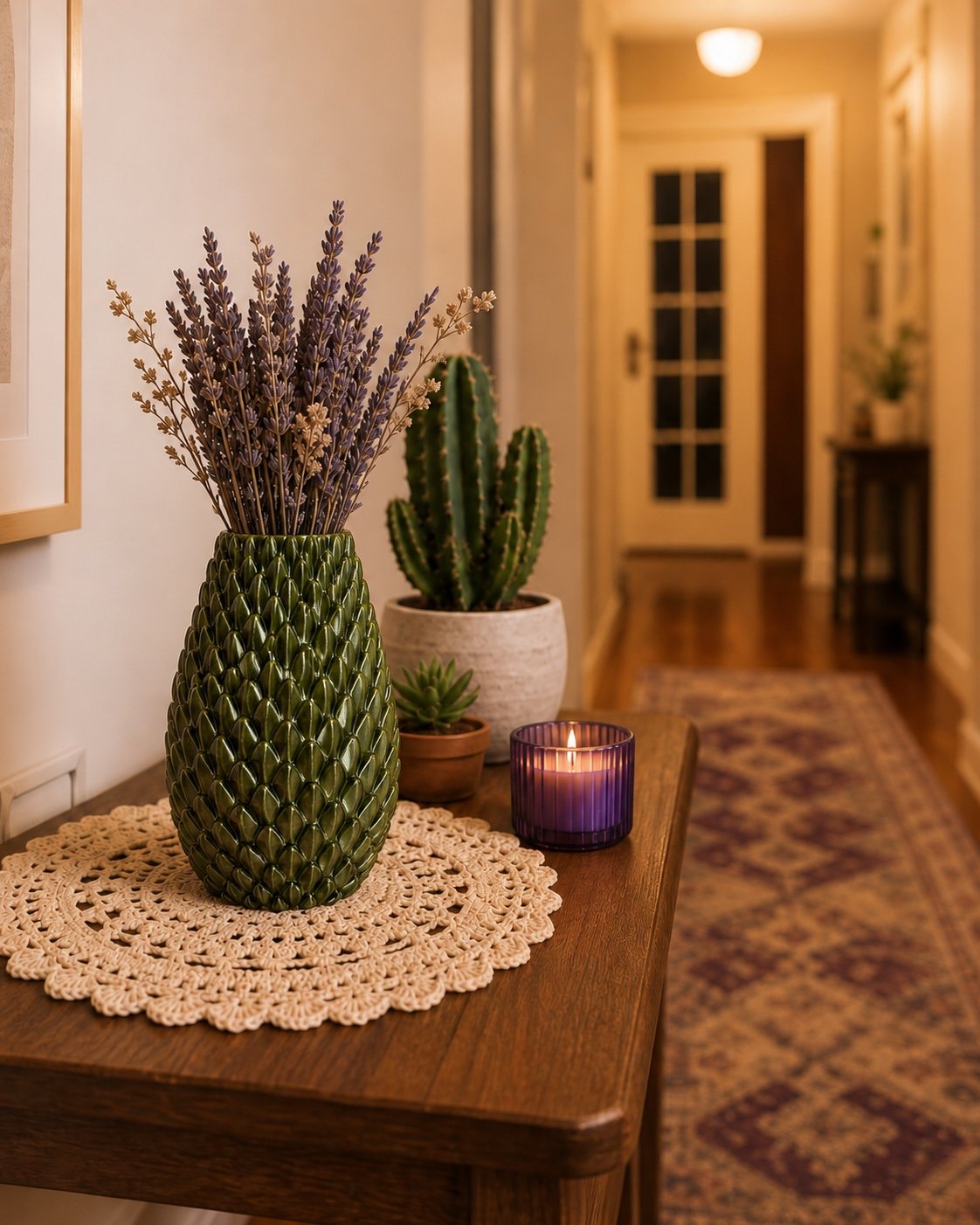 Olive-green 3D printed dragon scale vase holding lavender in a hallway.