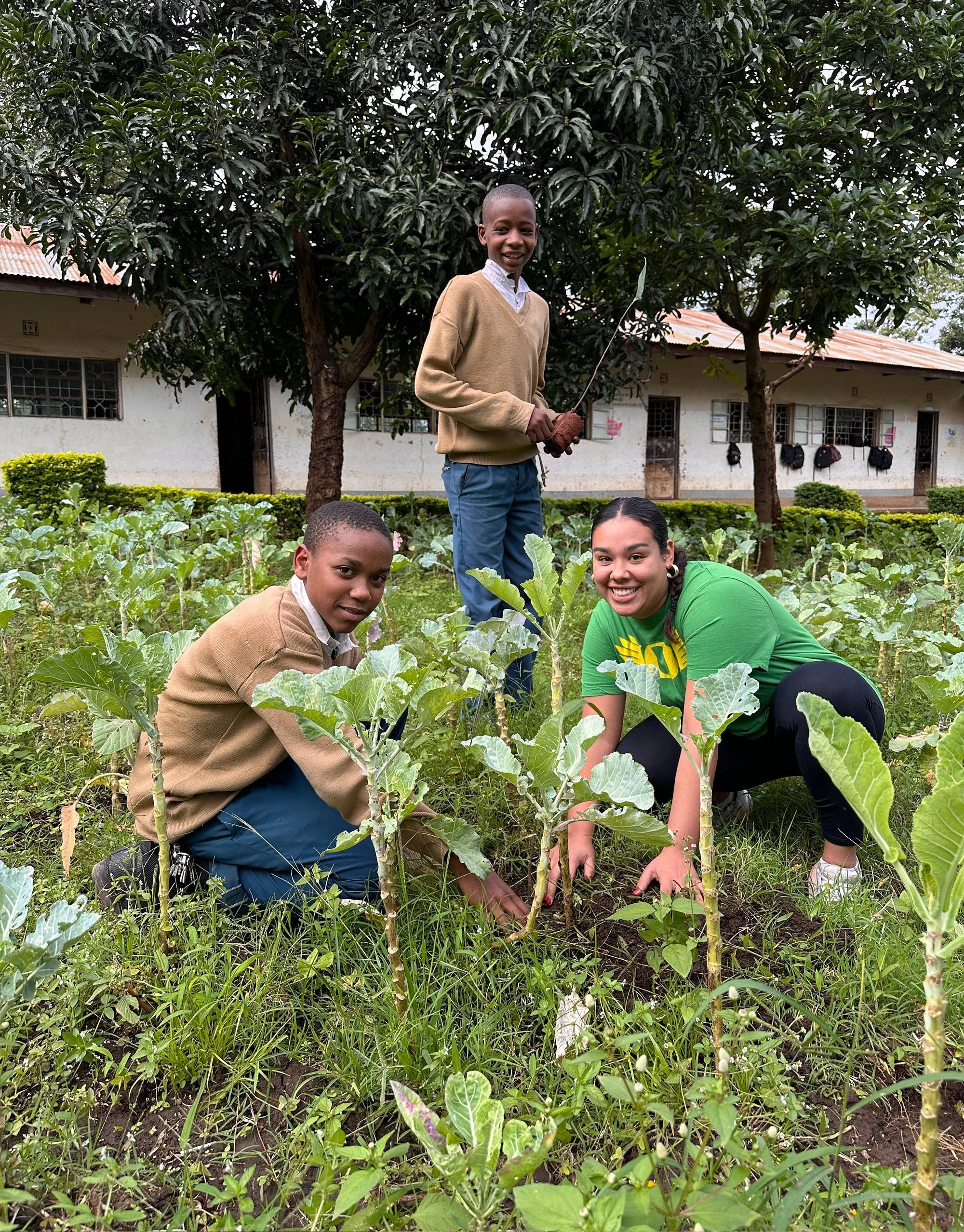 Students working in a community garden during a study abroad program in Arusha