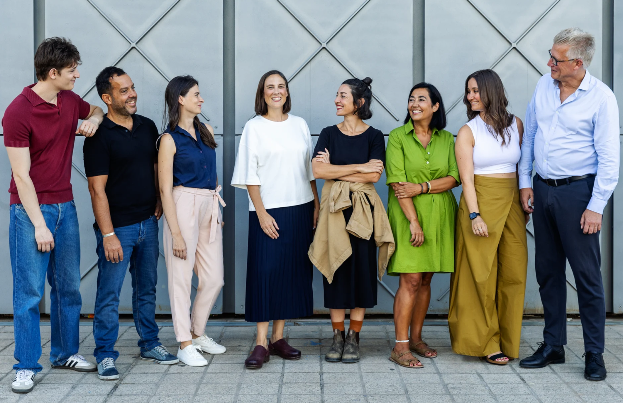 Team of diverse professionals from Academic Solutions standing together