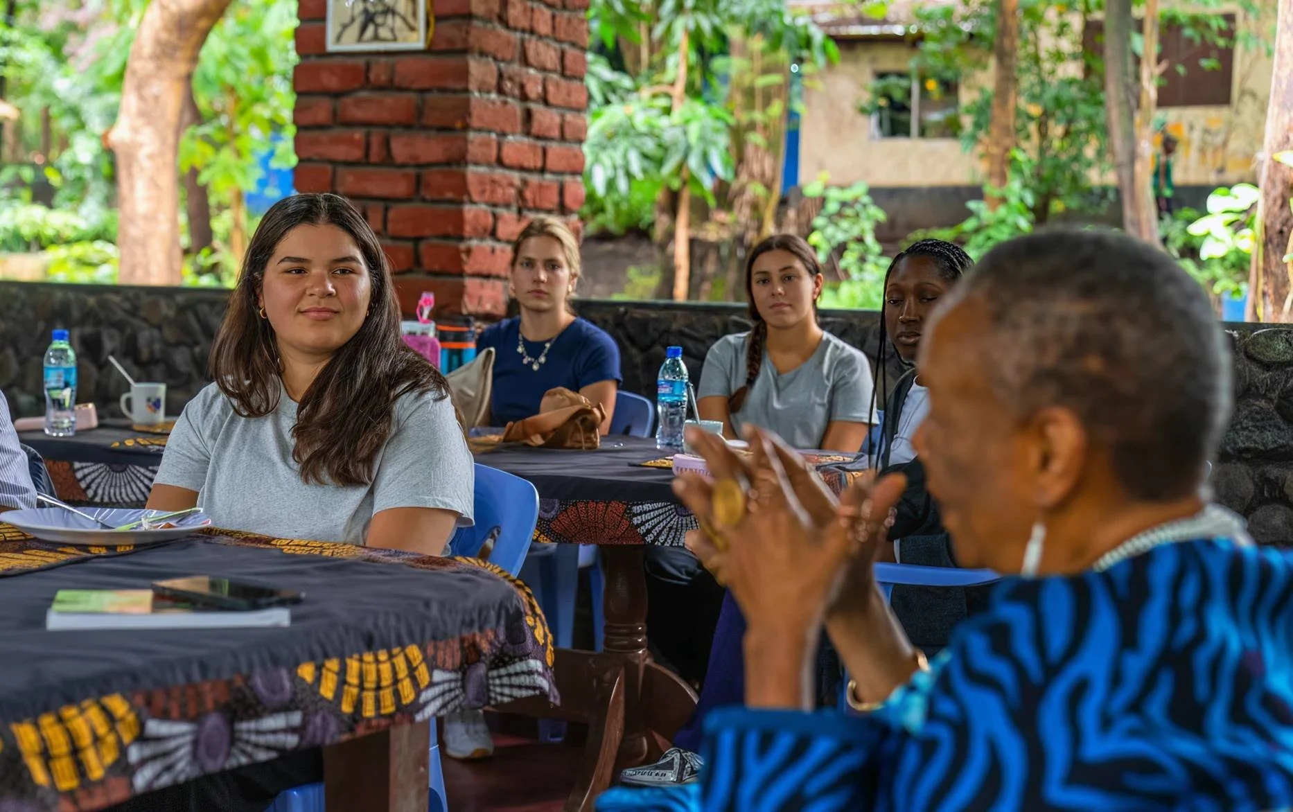 Students listening to a speaker during a study abroad class