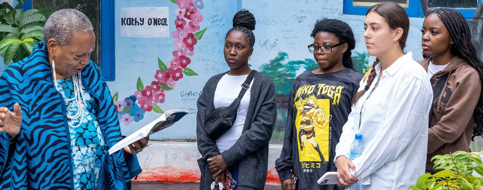 Students listening to a local teacher during a study abroad program in Arusha Tanzania