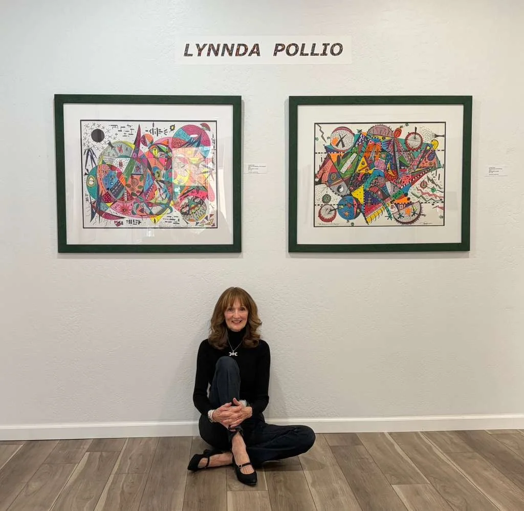 Lynnda Pollio sitting on floor in front of her exhibition at Fine Art Museum of Sedona at the opening night of Resonance: Frequency and Legacy.
