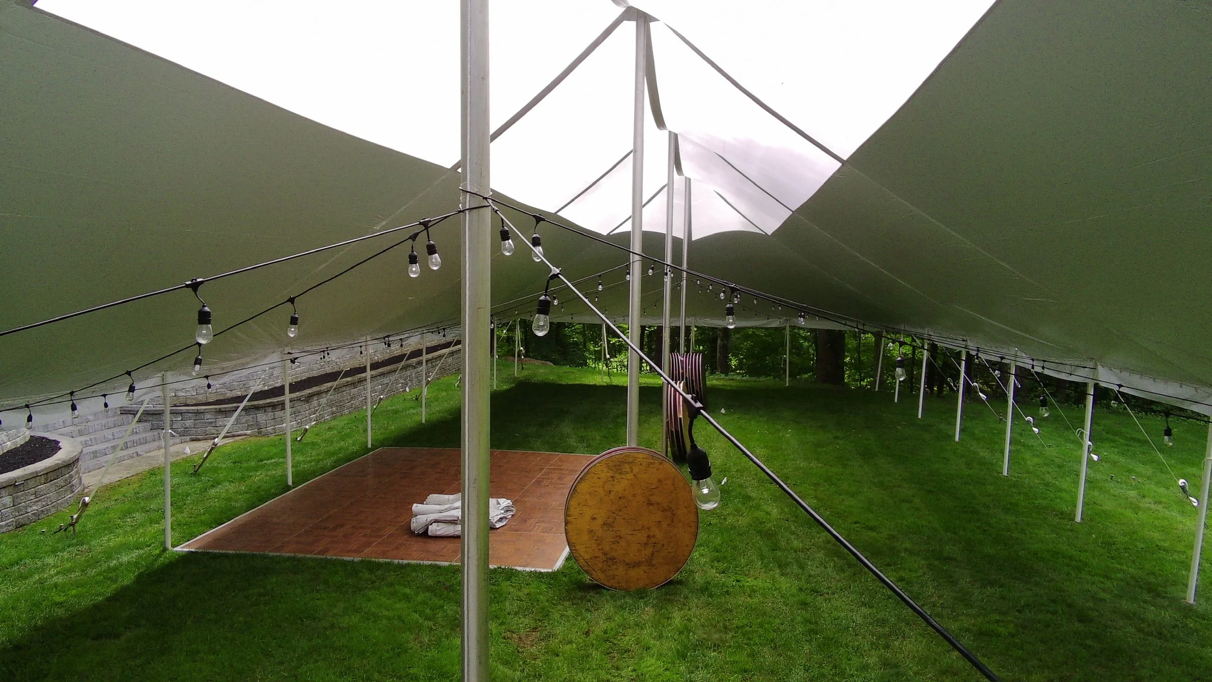Skylight tent with Edison lights setup for a wedding in Waterford, NY. Setup by Whalen Tents