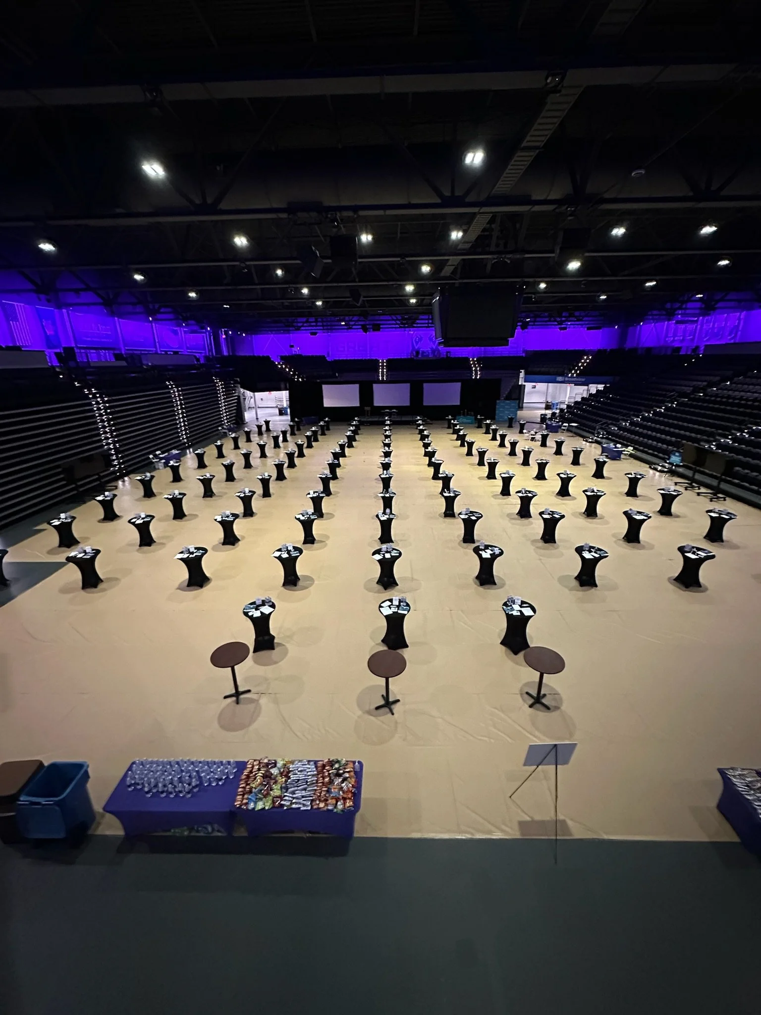 30" cocktail tables with black stretch linen setup at SUNY Albany Broadview Arena. Setup by Whalen Tents
