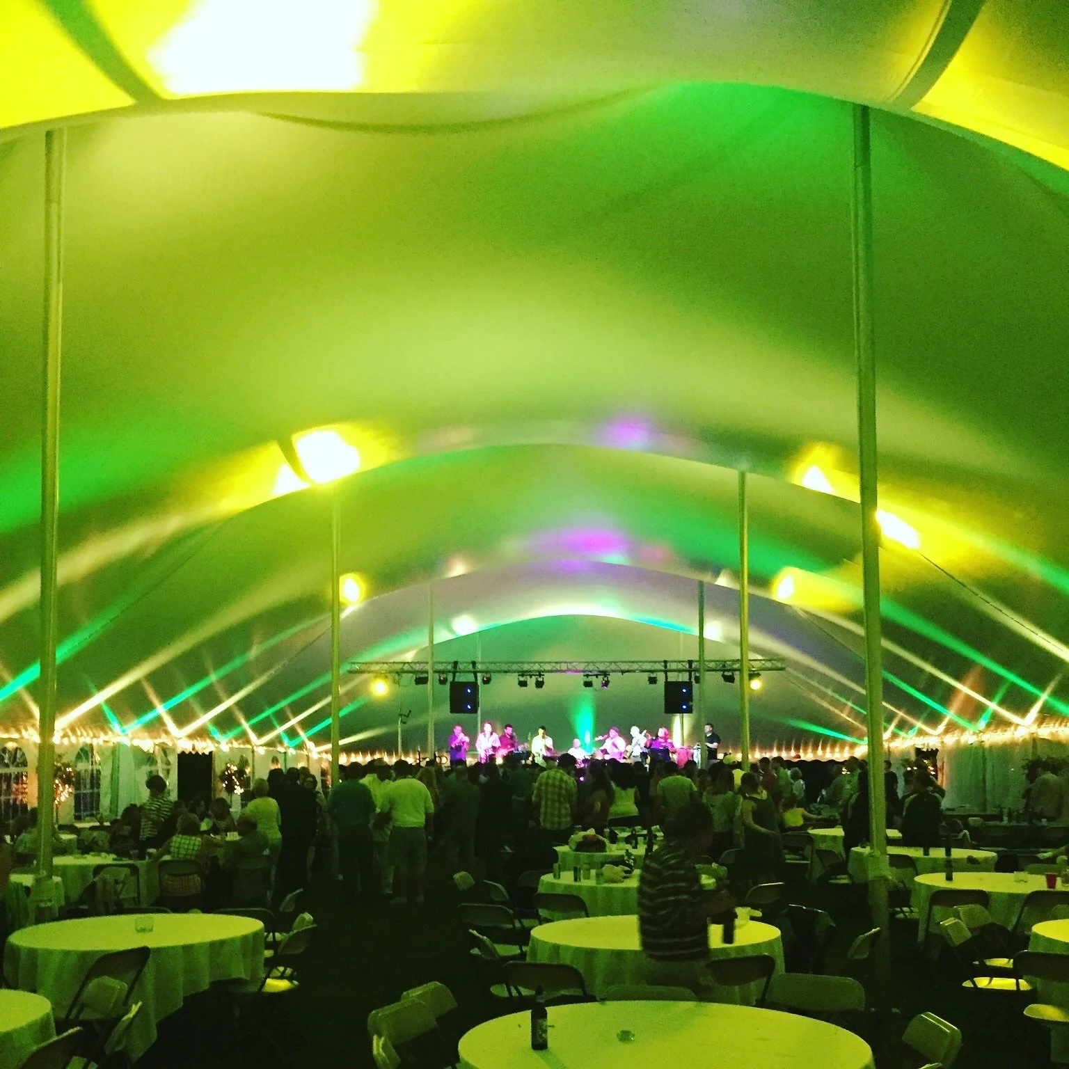 Up lighting show on a 60 x 180 tent at Skidmore college in Saratoga, NY setup by Whalen Tents