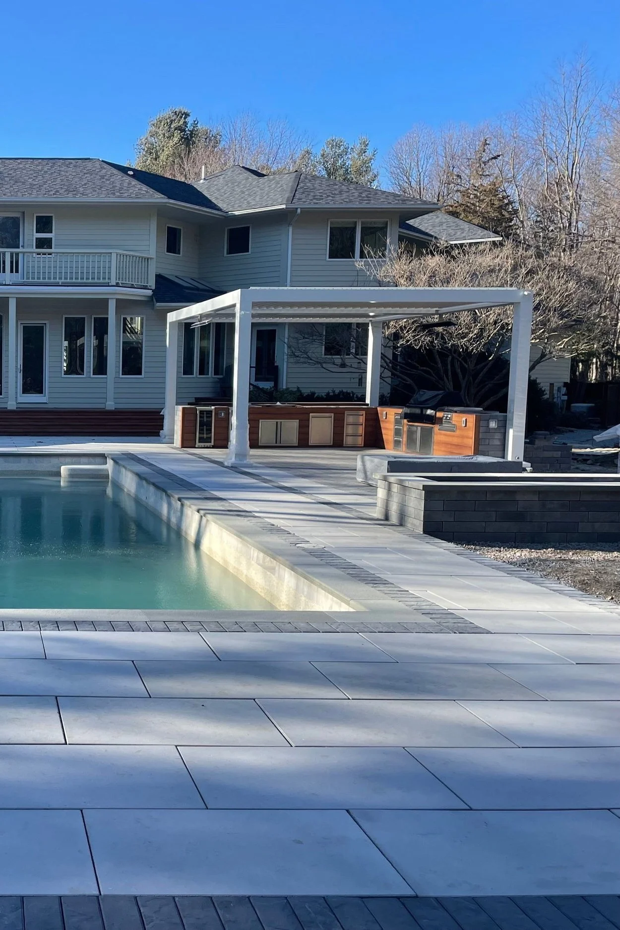 Combine a Pergola and Paver Patio for Shade and Style in the North Kingstown, RI Area