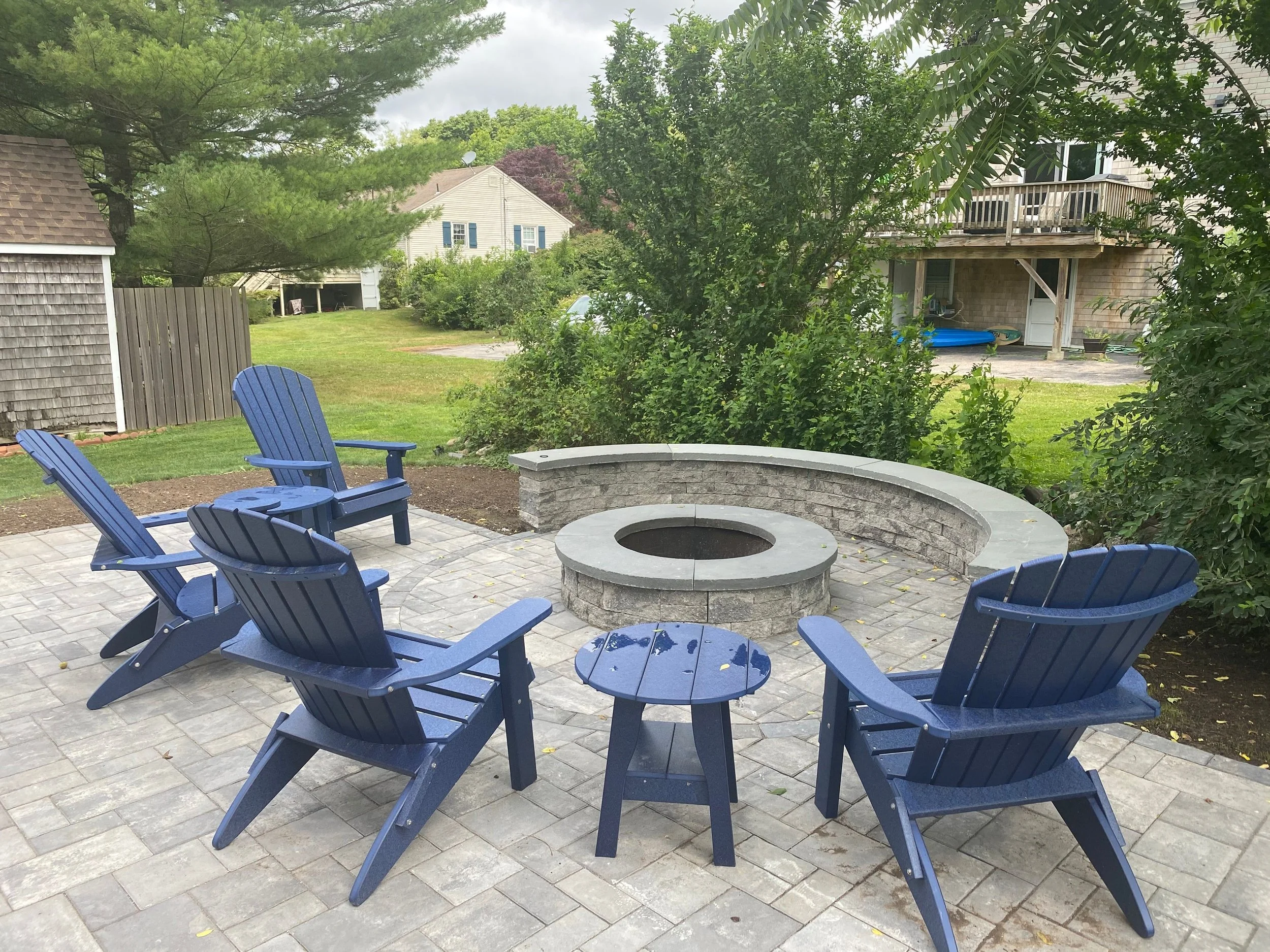 Beyond Borders: Extend Your Landscape With a Retaining Wall and a Fire Pit in the South Kingstown, RI Areas