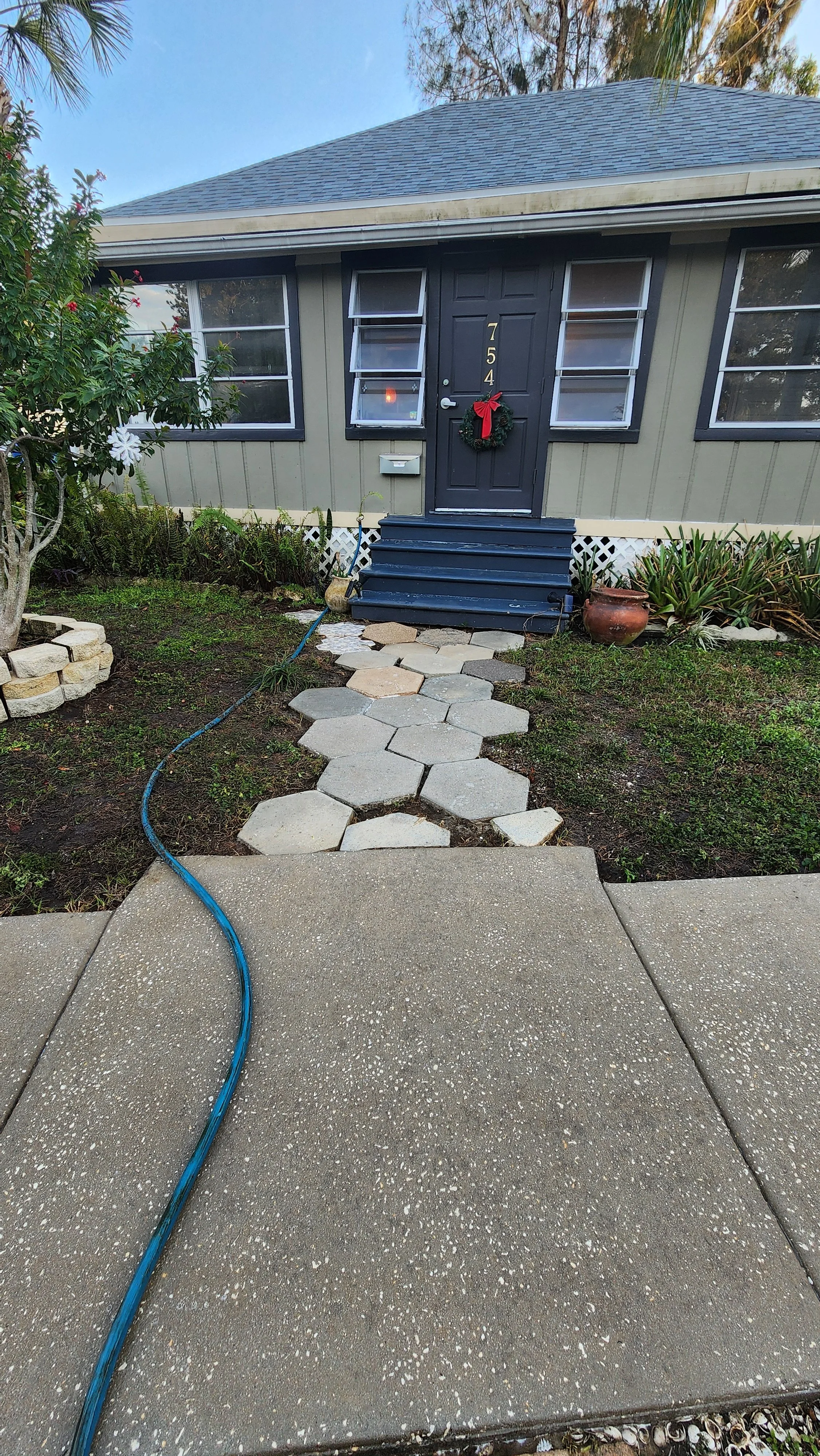 Old NE paver entry way pressure washing after Jungle Nation