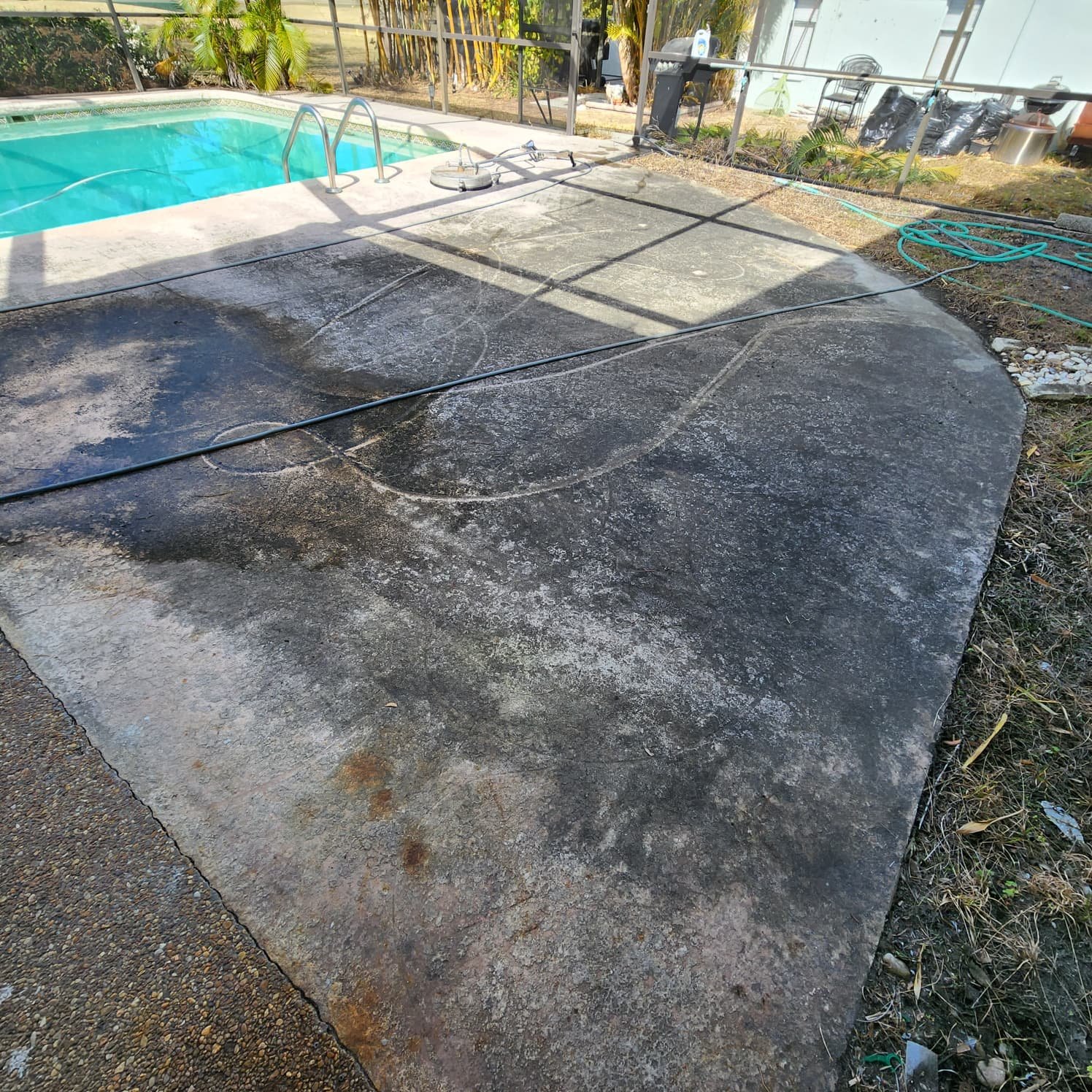 seminole painted pool deck pressure washing before Jungle Nation
