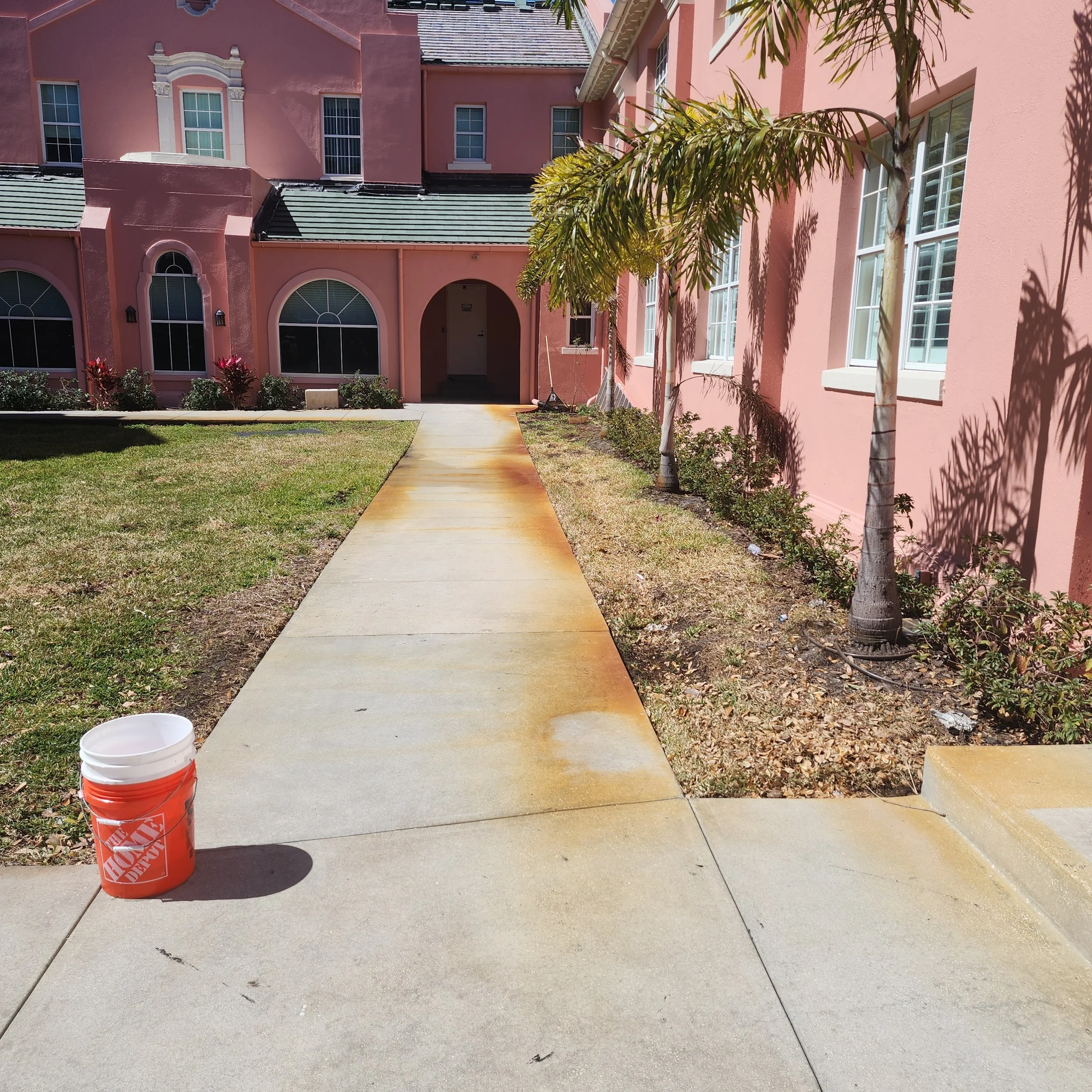 St Petersburg Church sidewalk rust removal and pressure washing before with Jungle Nation