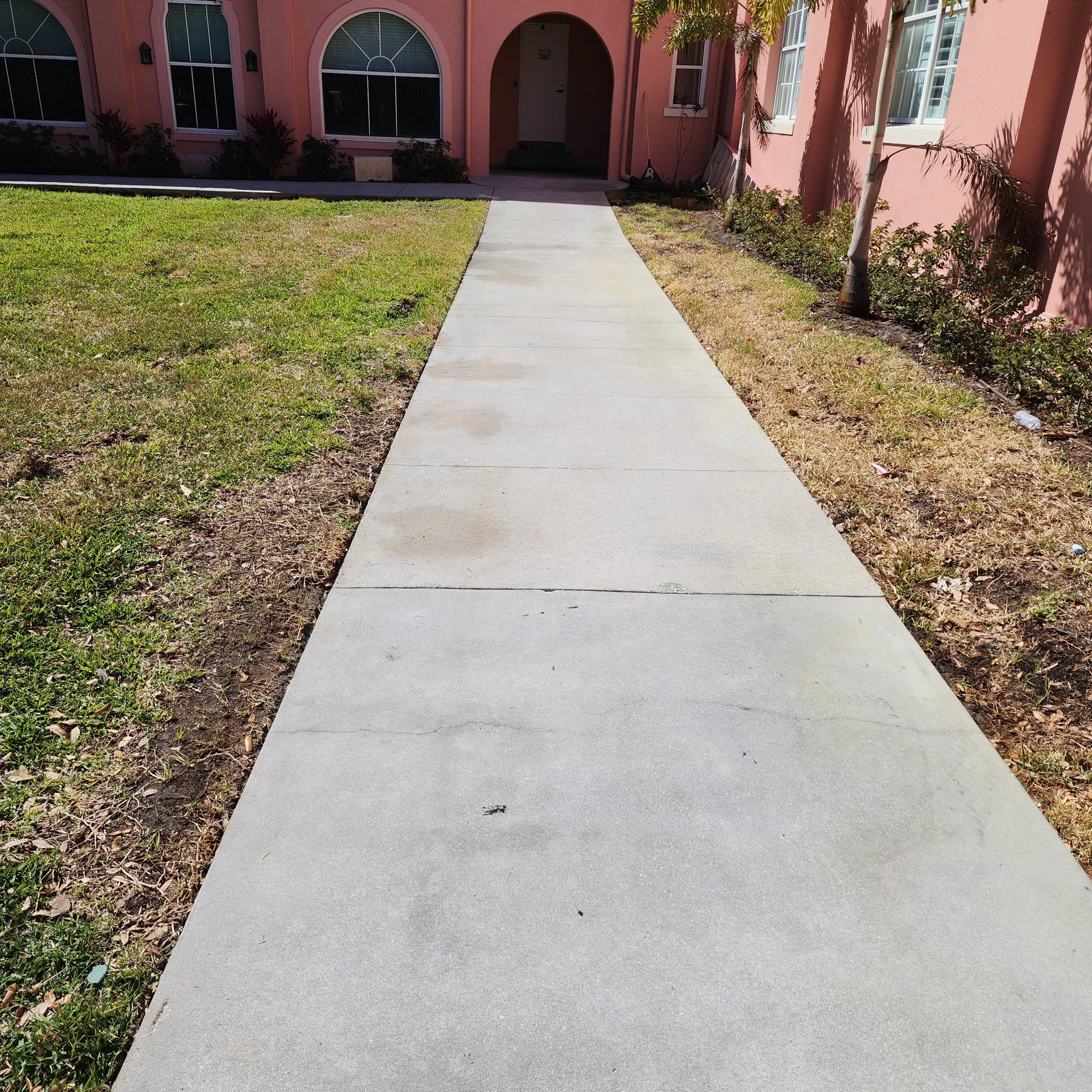 St Petersburg Church sidewalk rust removal and pressure washing after with Jungle Nation