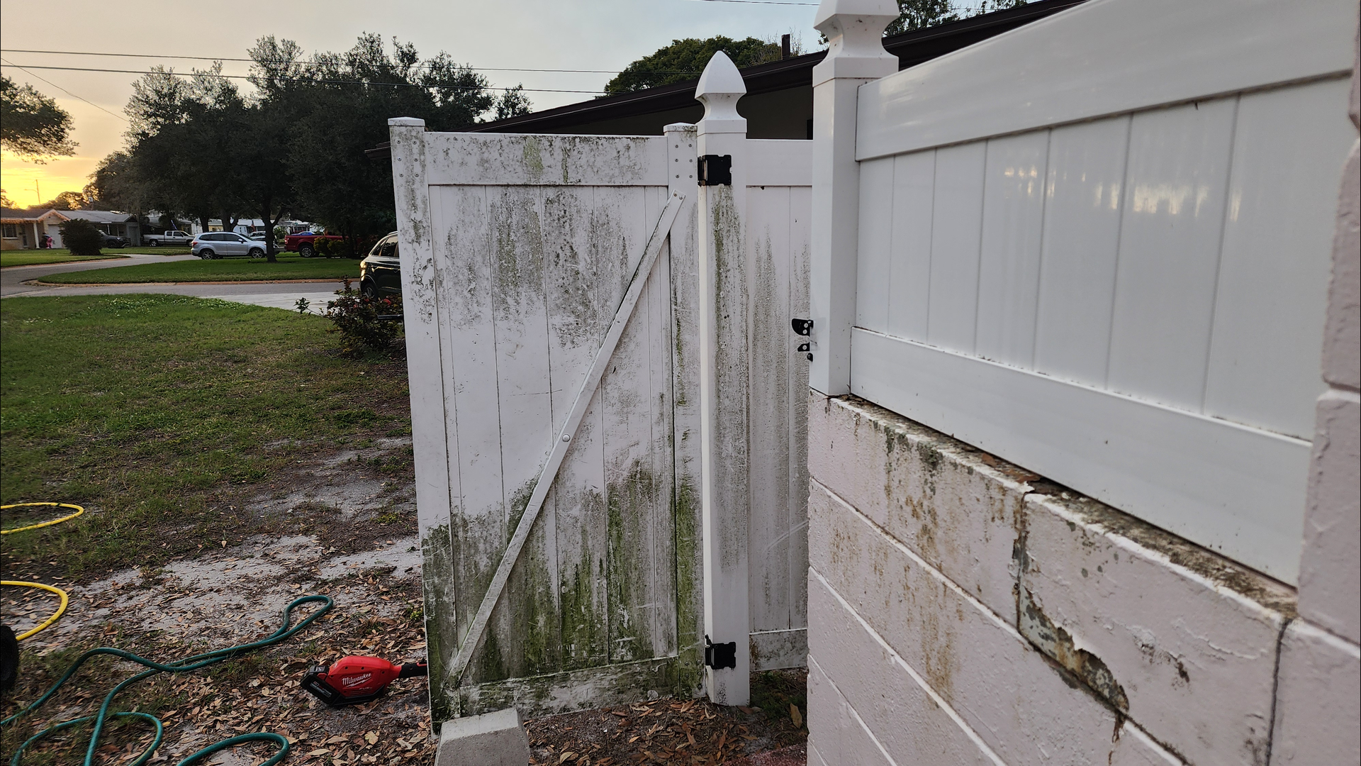 kenneth city vinyl fence soft wash before Jungle Nation