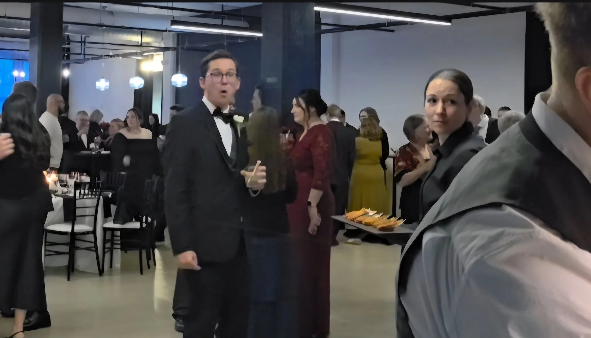 Wedding guest reacts to live wedding painting by live wedding painter.