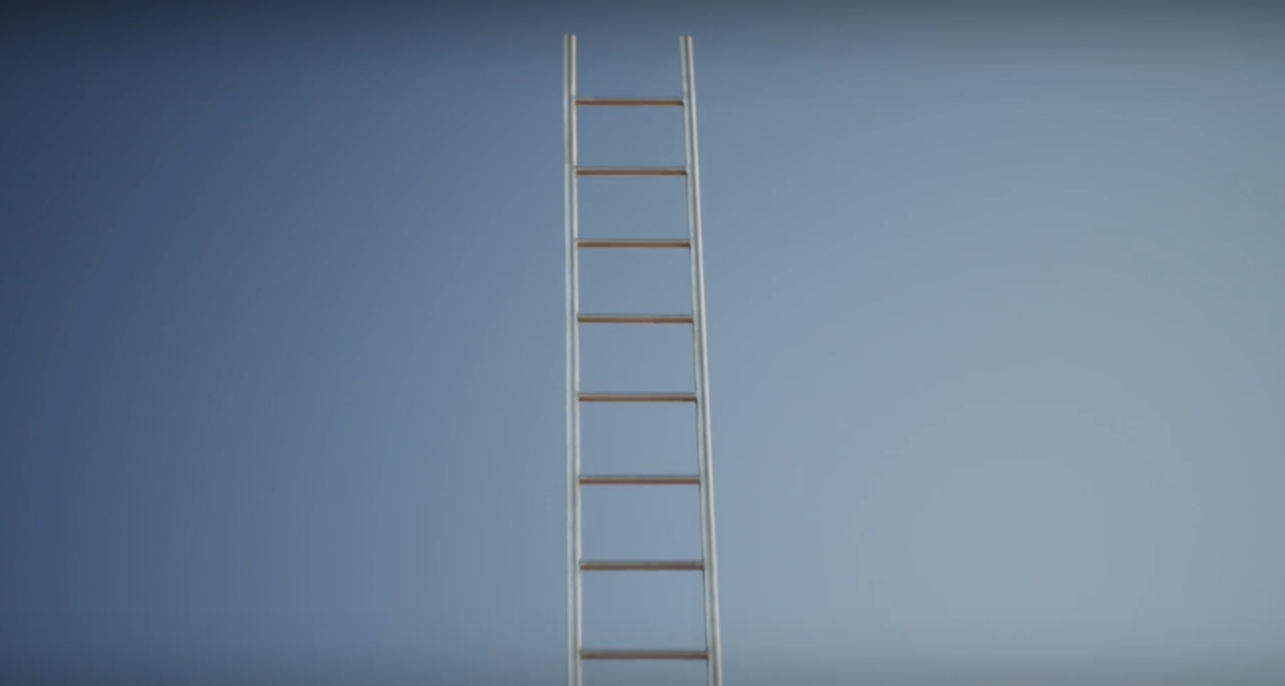 A silver ladder extending upward against a clear blue sky.