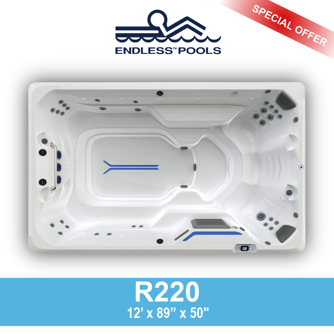 Top view of a white hot tub with multiple jets, seating areas, and blue accent lines, branded as 'Endless Pools', labeled 'R220', with dimensions 12 by 89 by 50 inches. A red banner in the top right corner reads 'Special Offer'.