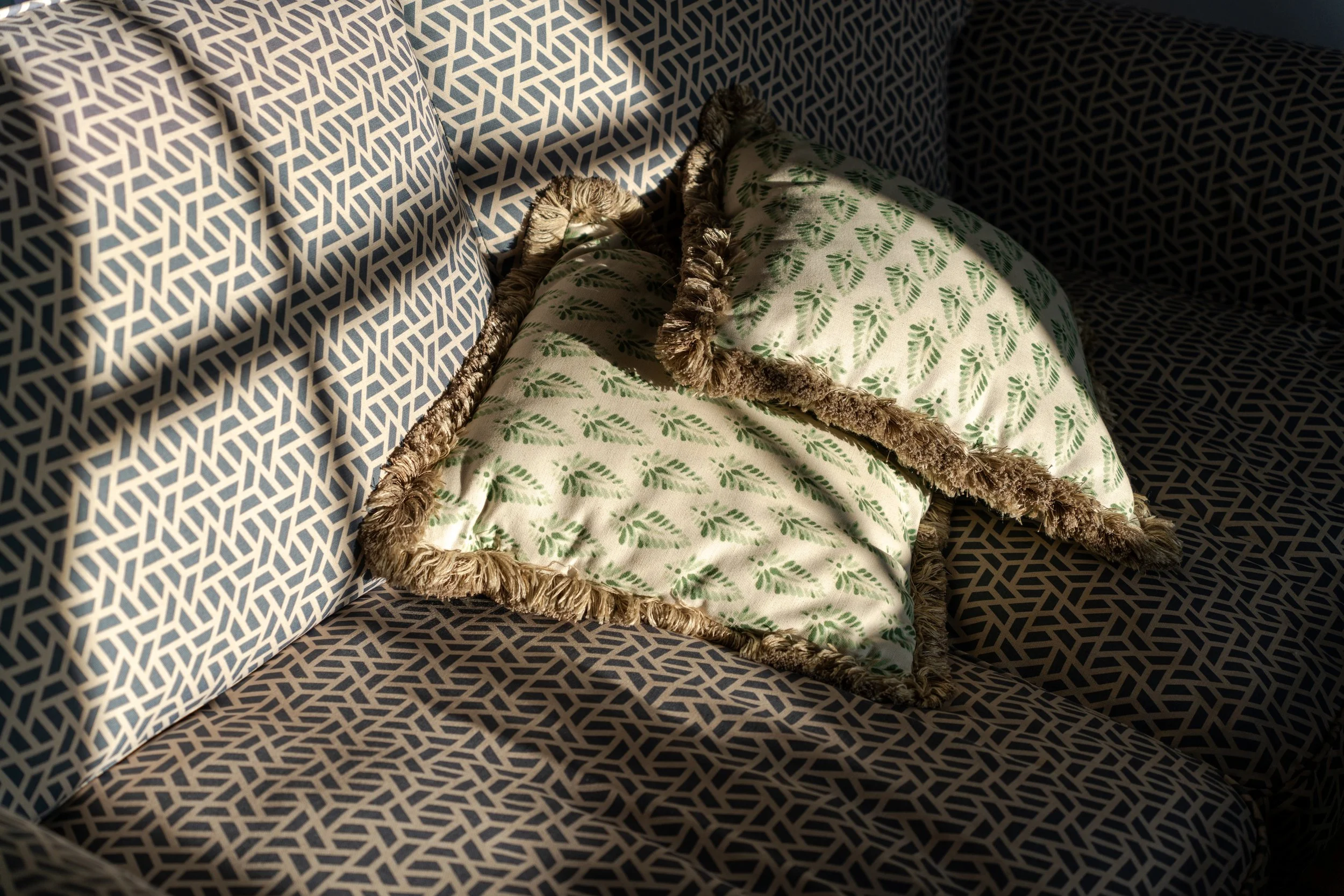 A couch with two cushions in a therapy office