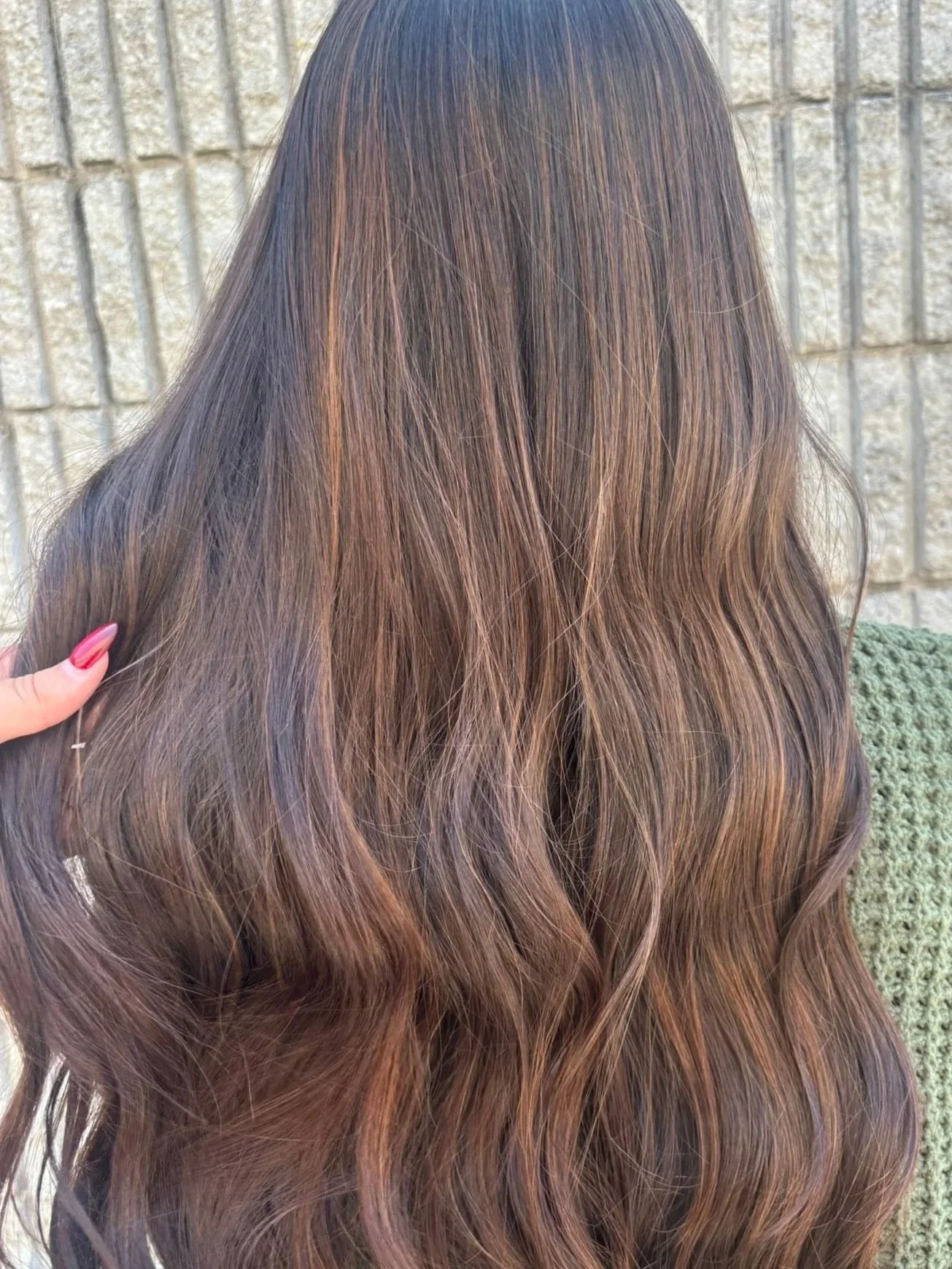 A field of daisy flowers with white petals and yellow centers, some in focus and others blurred in the background.