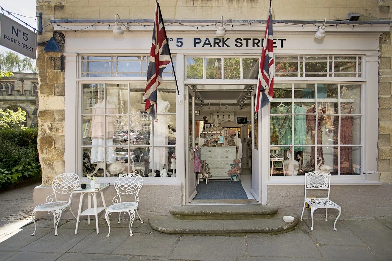 Vintage clothing shop with Union Jack flags hanging outside, signs indicating it is at 5 Park Street, to promote social media management for shops in cornwall.