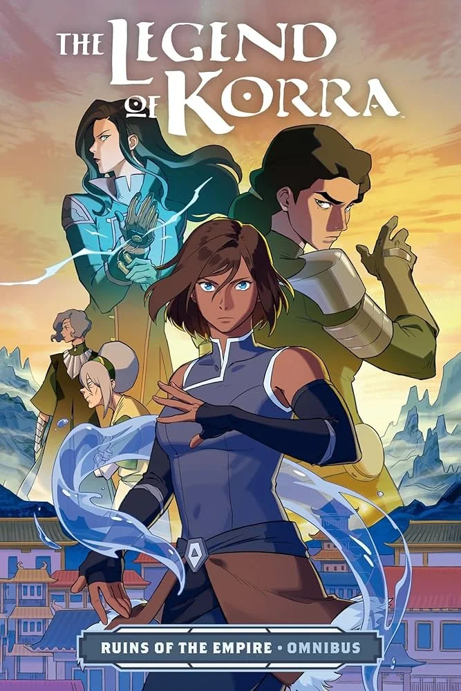 Cover art for 'The Legend of Korra: Ruins of the Empire Omnibus' featuring four main characters with anime-style art, set against a colorful sunset background with a cityscape and mountains.