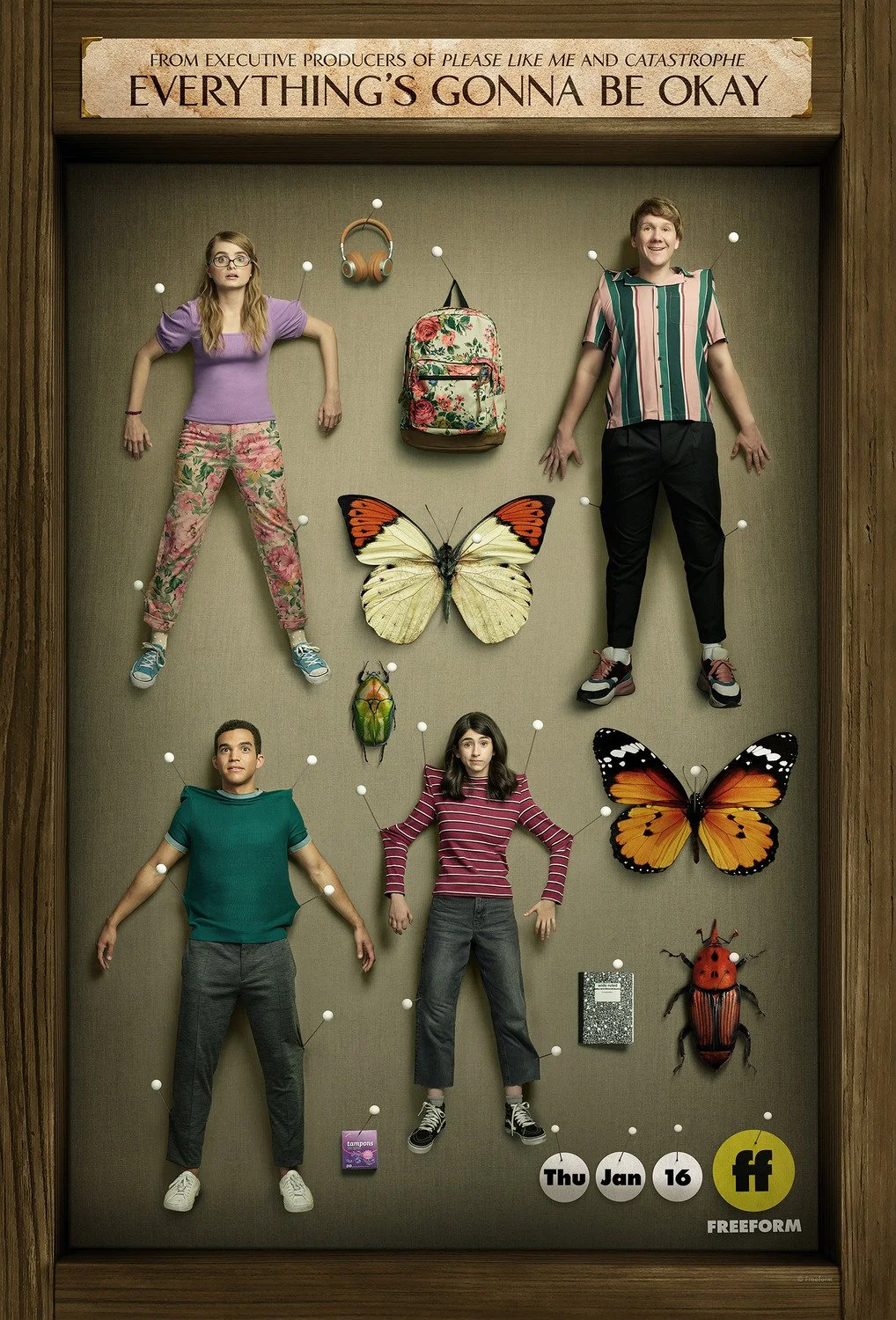 Display of four people lying on a wall with pins and butterflies, insects, and objects pinned around them, with a sign that reads 'Everything's Gonna Be Okay' at the top.
