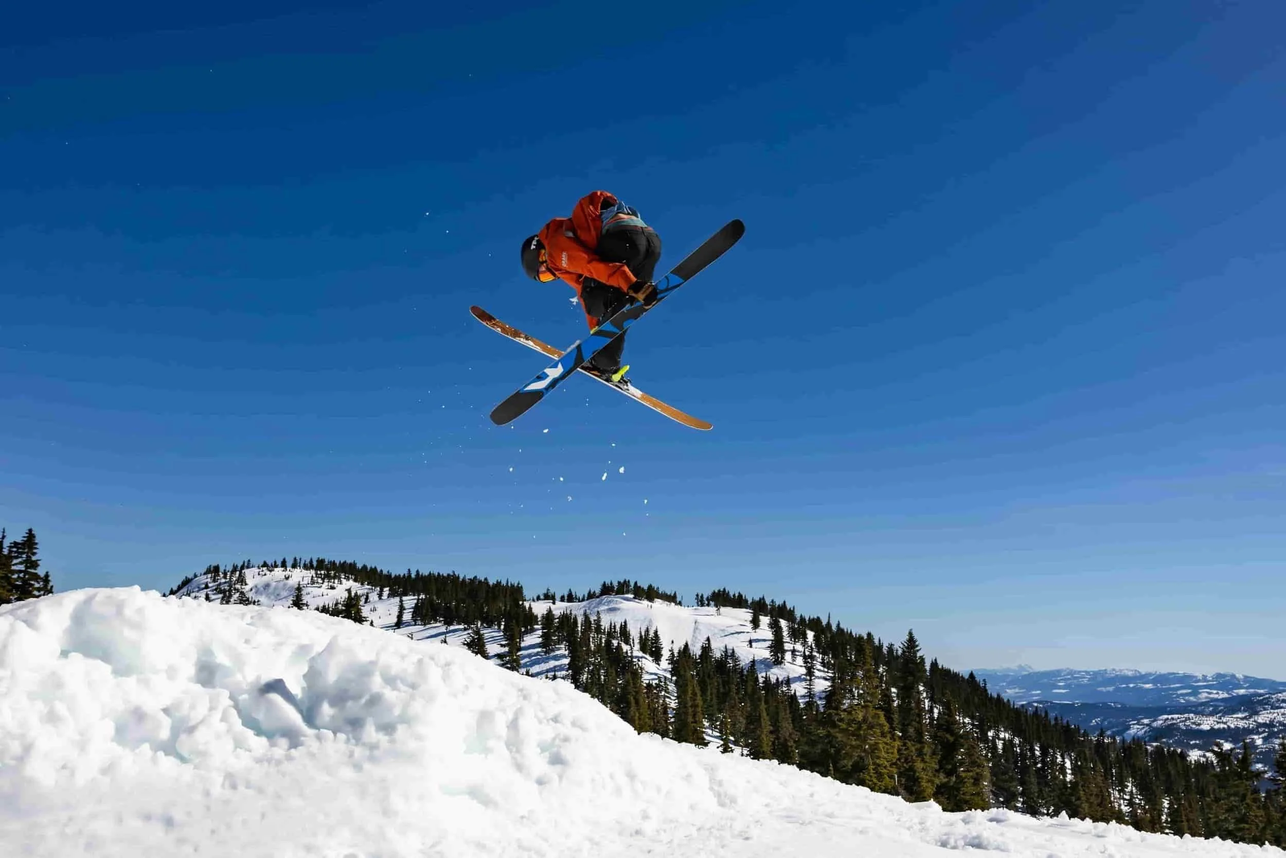 Enthusiast skier jumping catching air