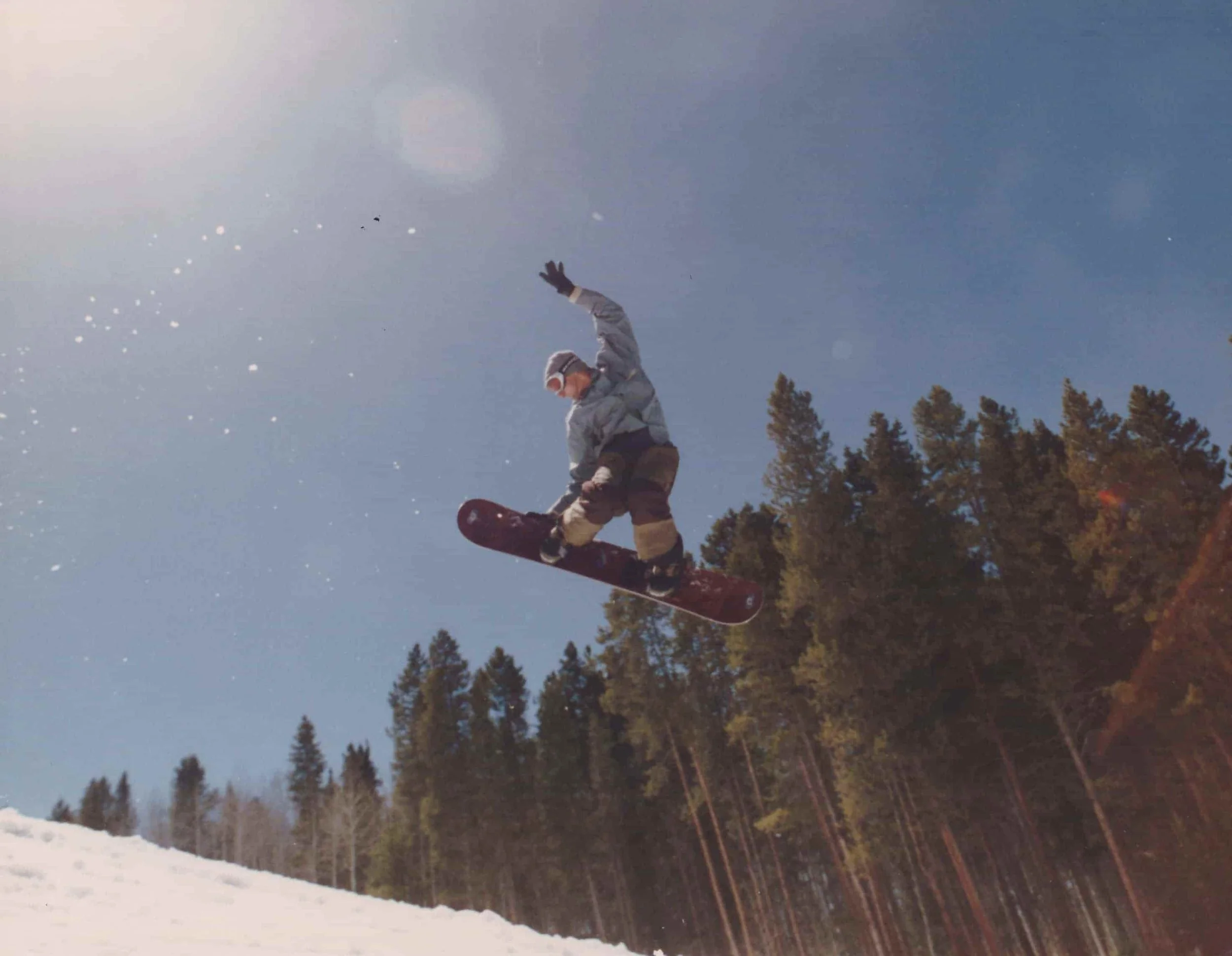 Chris snowboarding and catching air in 1995