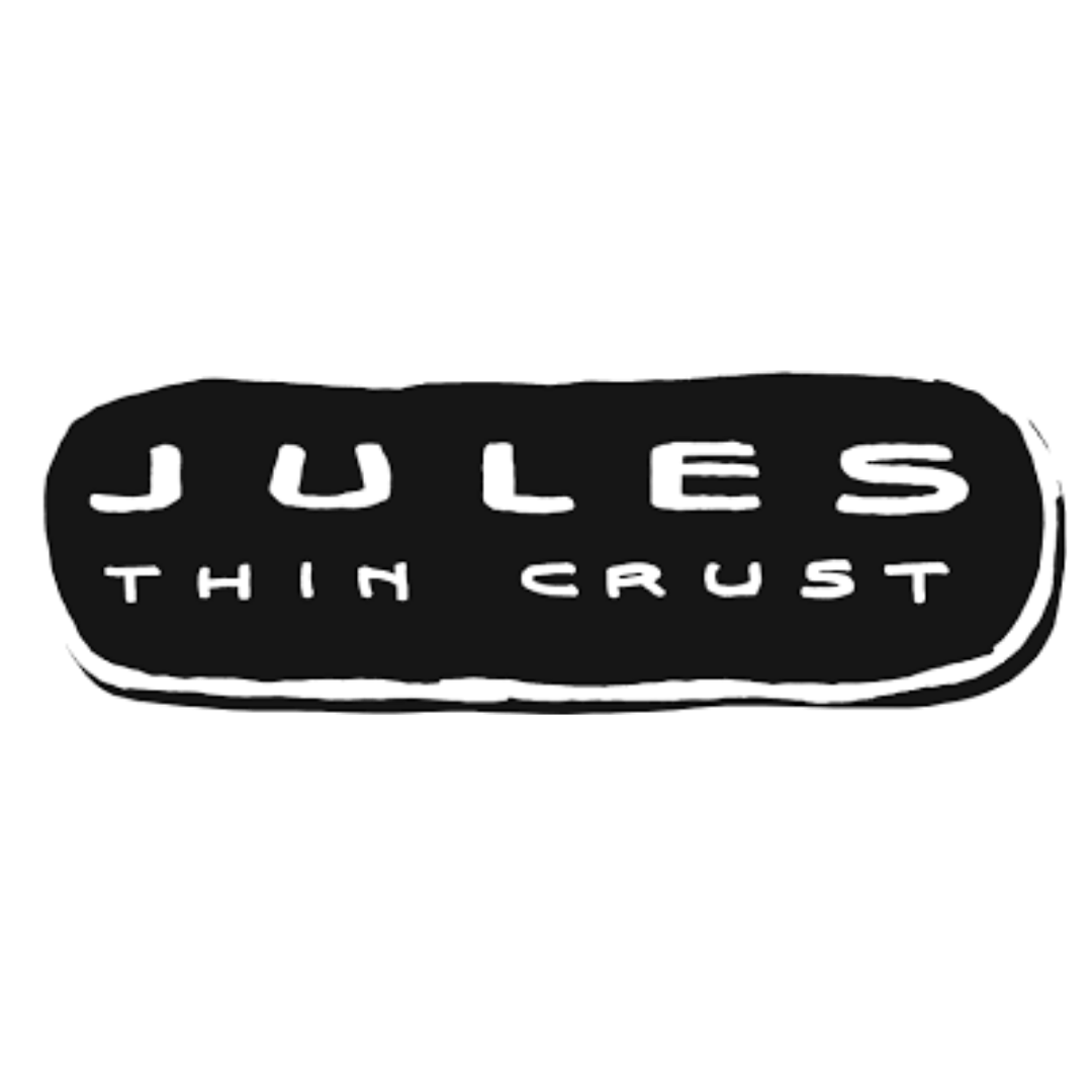 Black button with the phrase "Jules Thim Gust" embossed in raised letters.