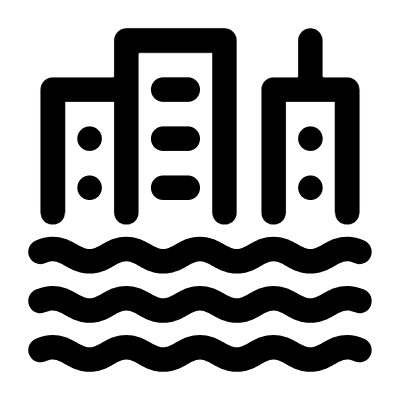 Silhouette of city skyline with water waves in front.