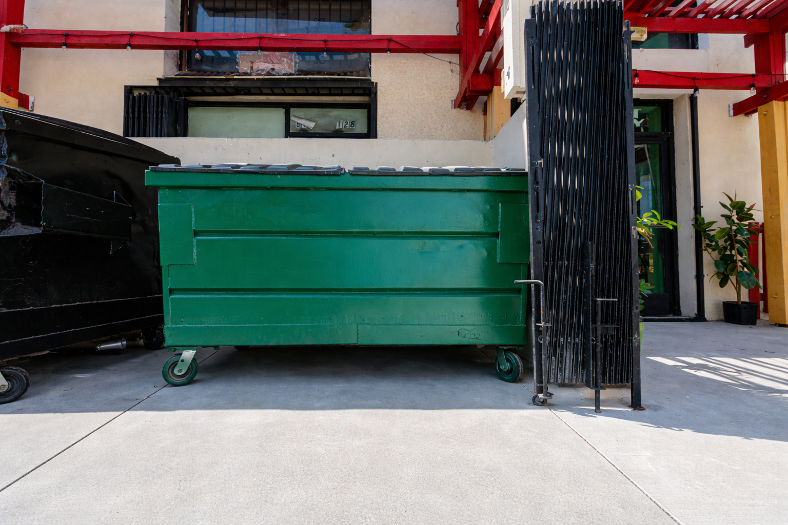 clean dumpster pad pressure washing