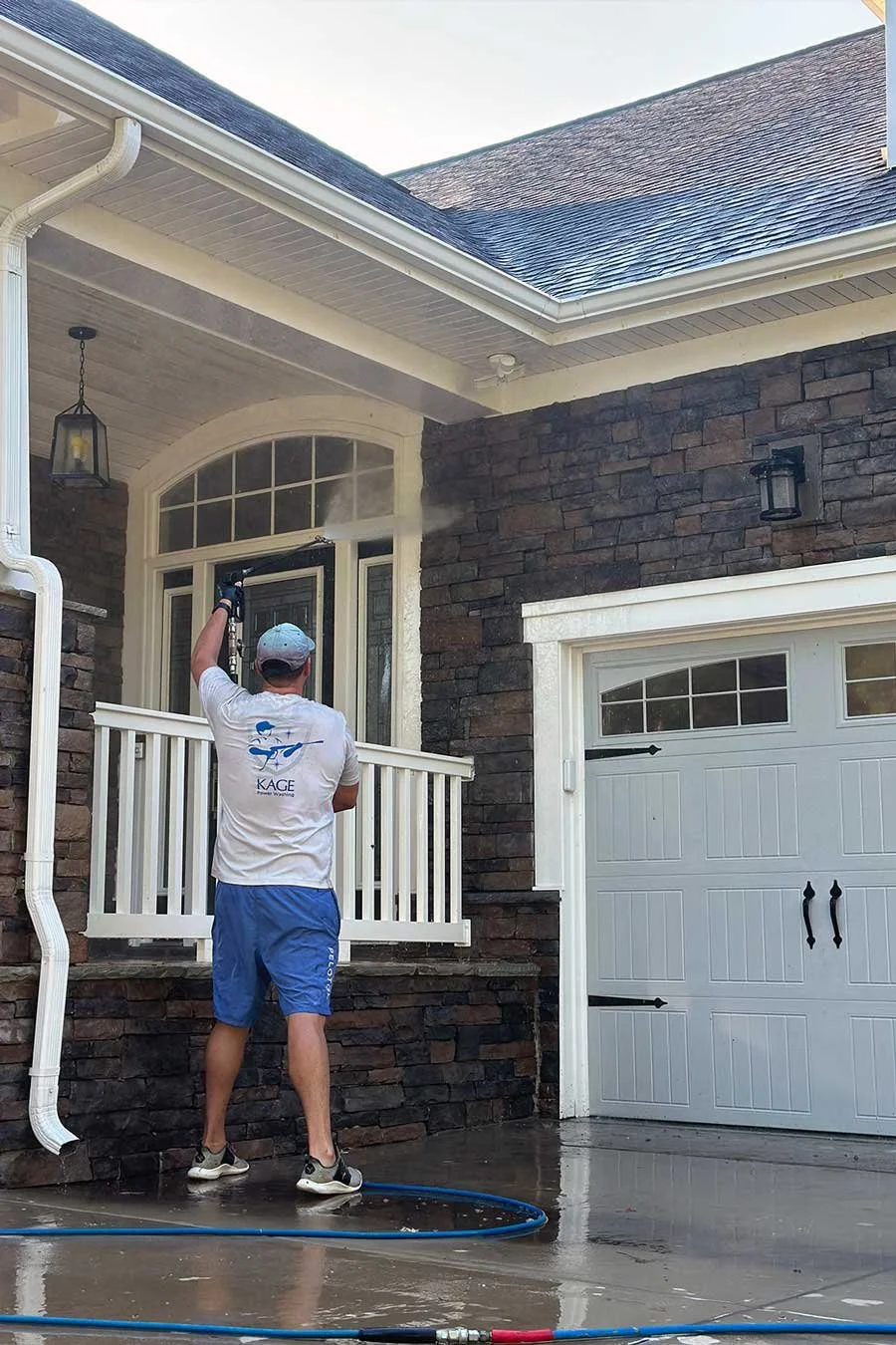 Front porch stone being soft washed in Millbridge neighborhood of Waxhaw, NC