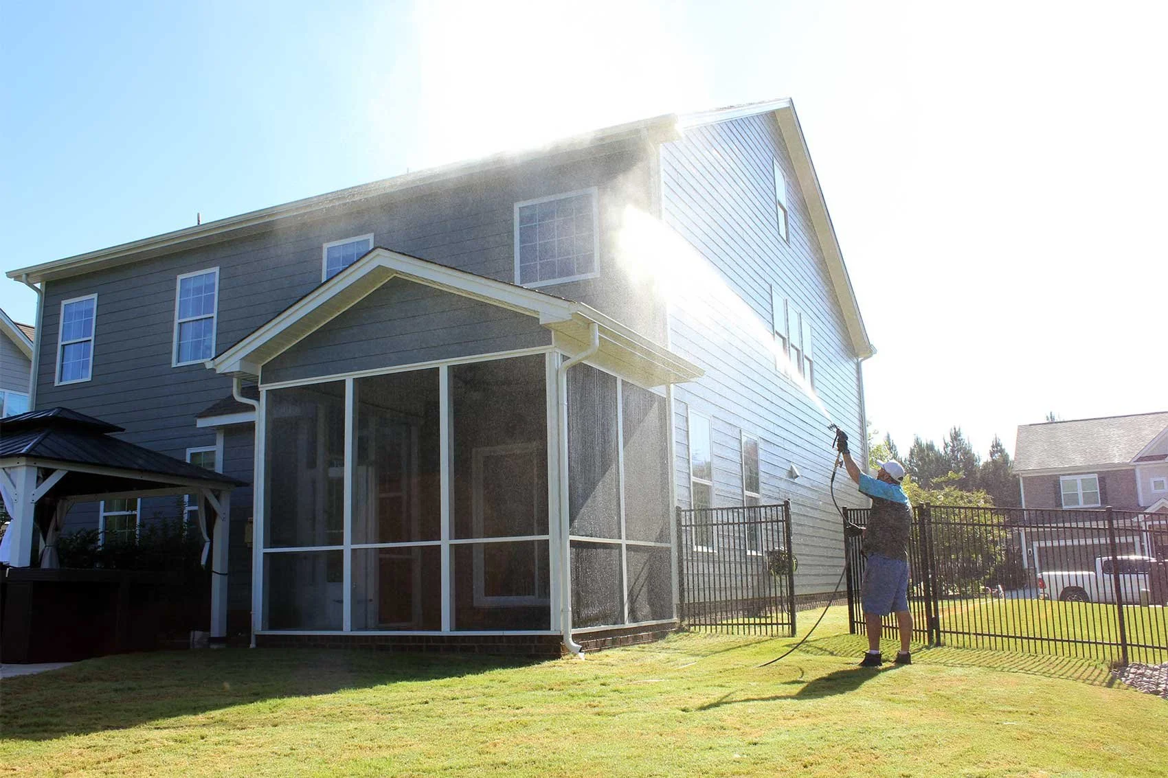 Power washing blue hardy siding in Waxhaw, NC