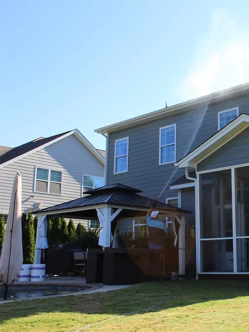 Pressure washing the back of a house in Waxhaw, NC.