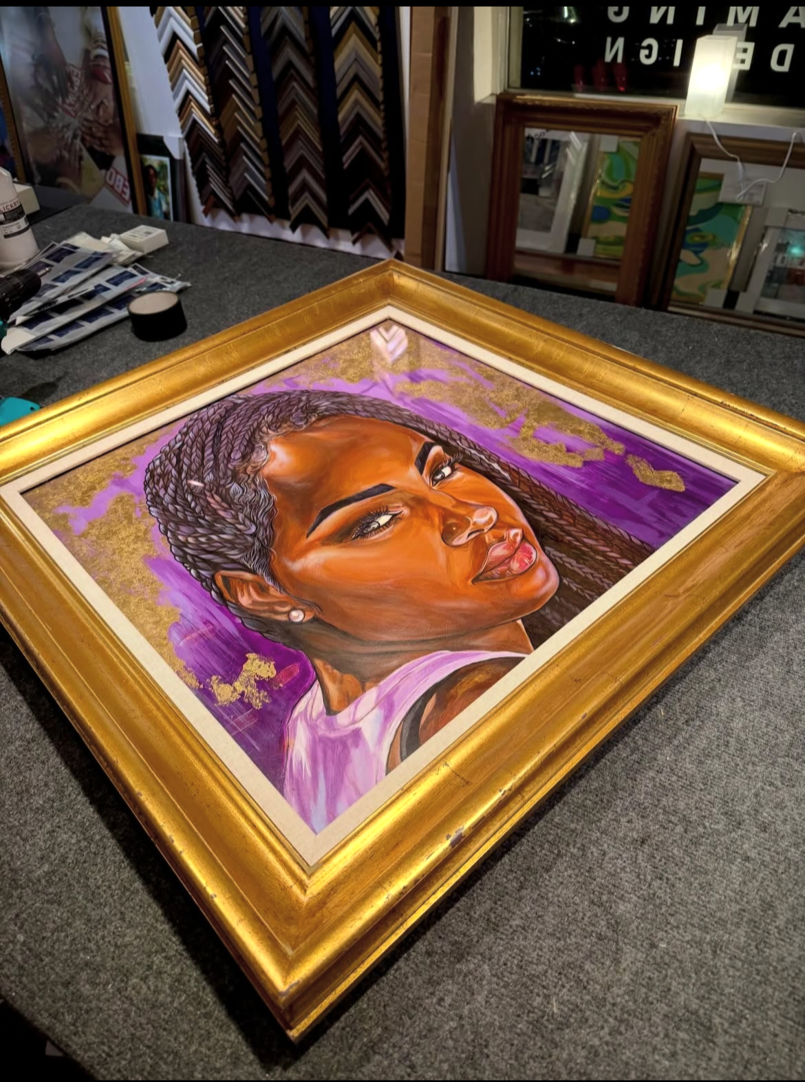 Laurie’s customers, Mariana and Carmen holding hands on a green lawn on their wedding day.