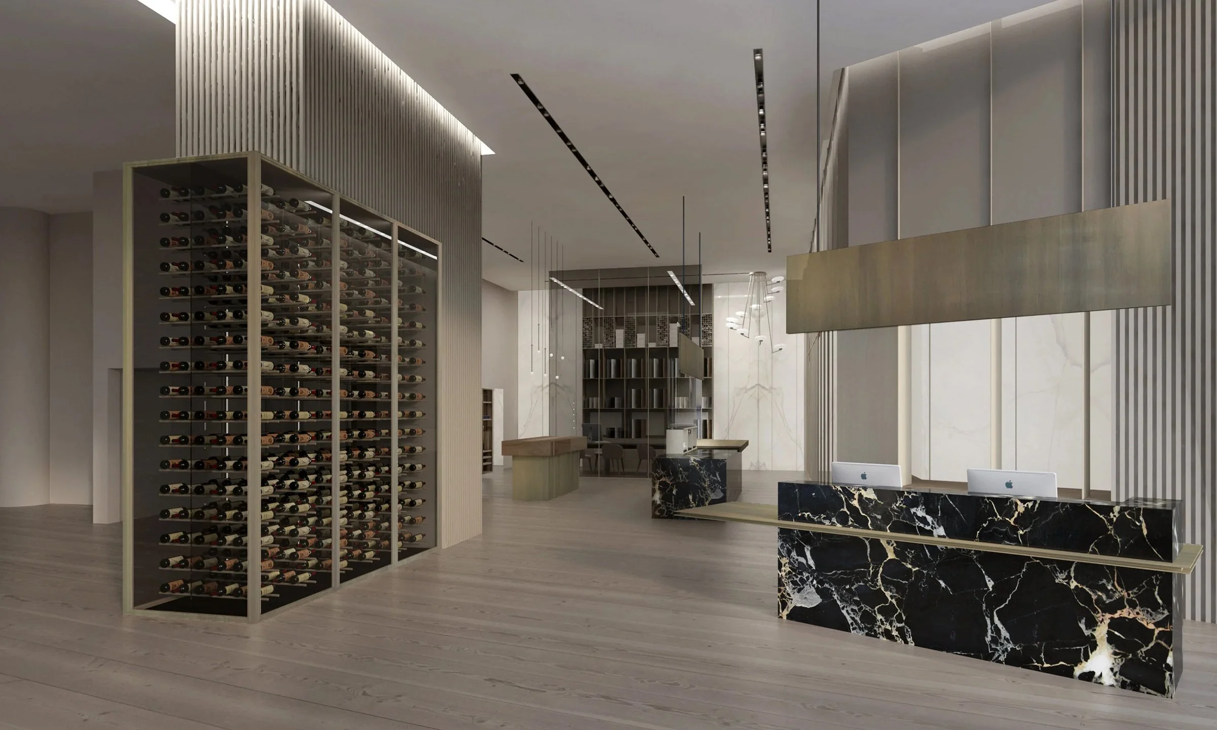 Interno di un elegante lounge con scaffale di vino, reception in marmo nero con venature bianche, e aree di lavoro con computer Apple. Atmosfera moderna con design raffinato.